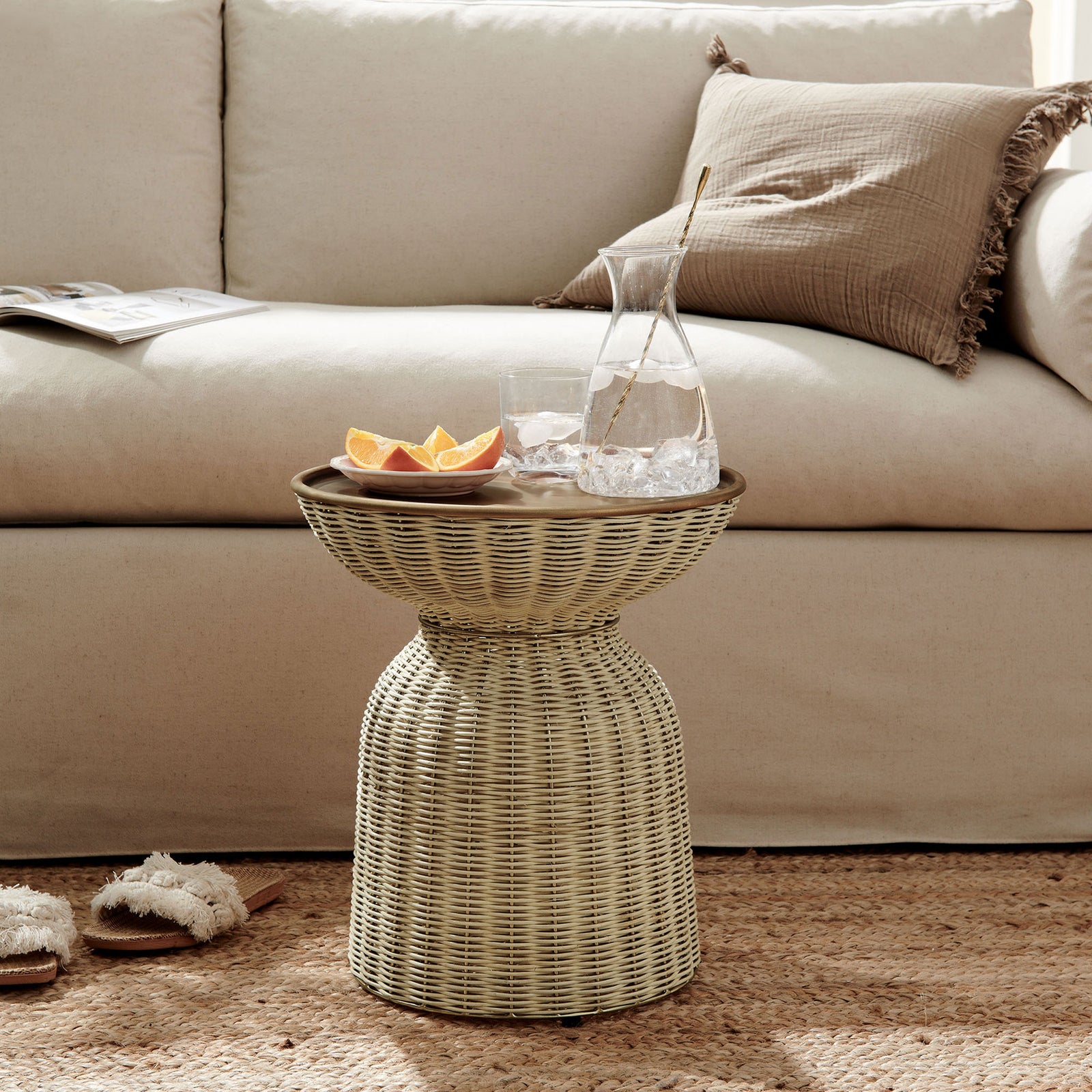 Lazaro rattan side table pairs effortlessly with a neutral sofa and jute rug for relaxed living. || EEI-7189-BBR-NAT || front_angle_room