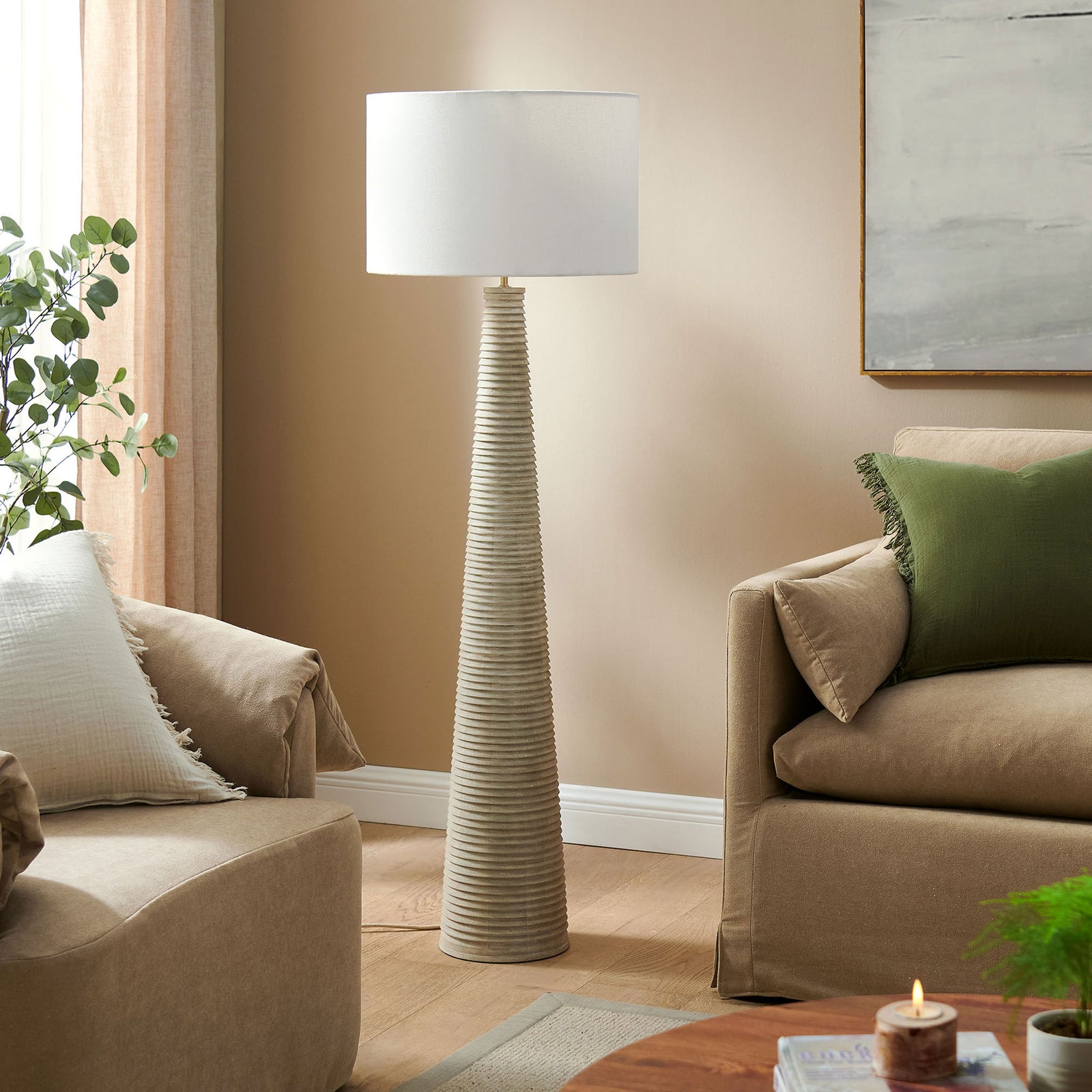 Ribbed wood floor lamp with white shade styled beside a soft neutral sofa || EEI-7190-WHI-GRY || front_room