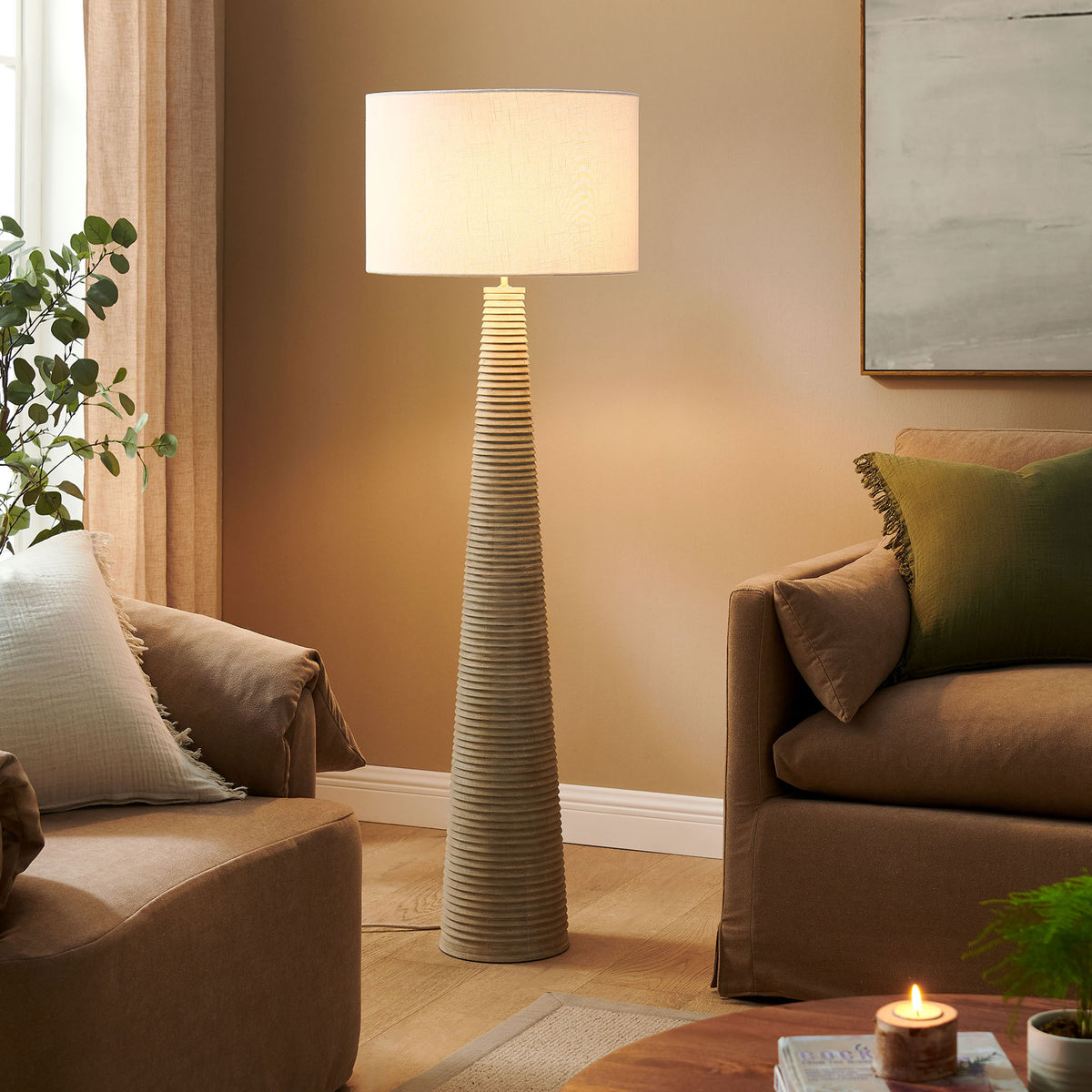 Ribbed wood floor lamp casting a warm glow in a relaxed modern living room || EEI-7190-WHI-GRY || front_on_room