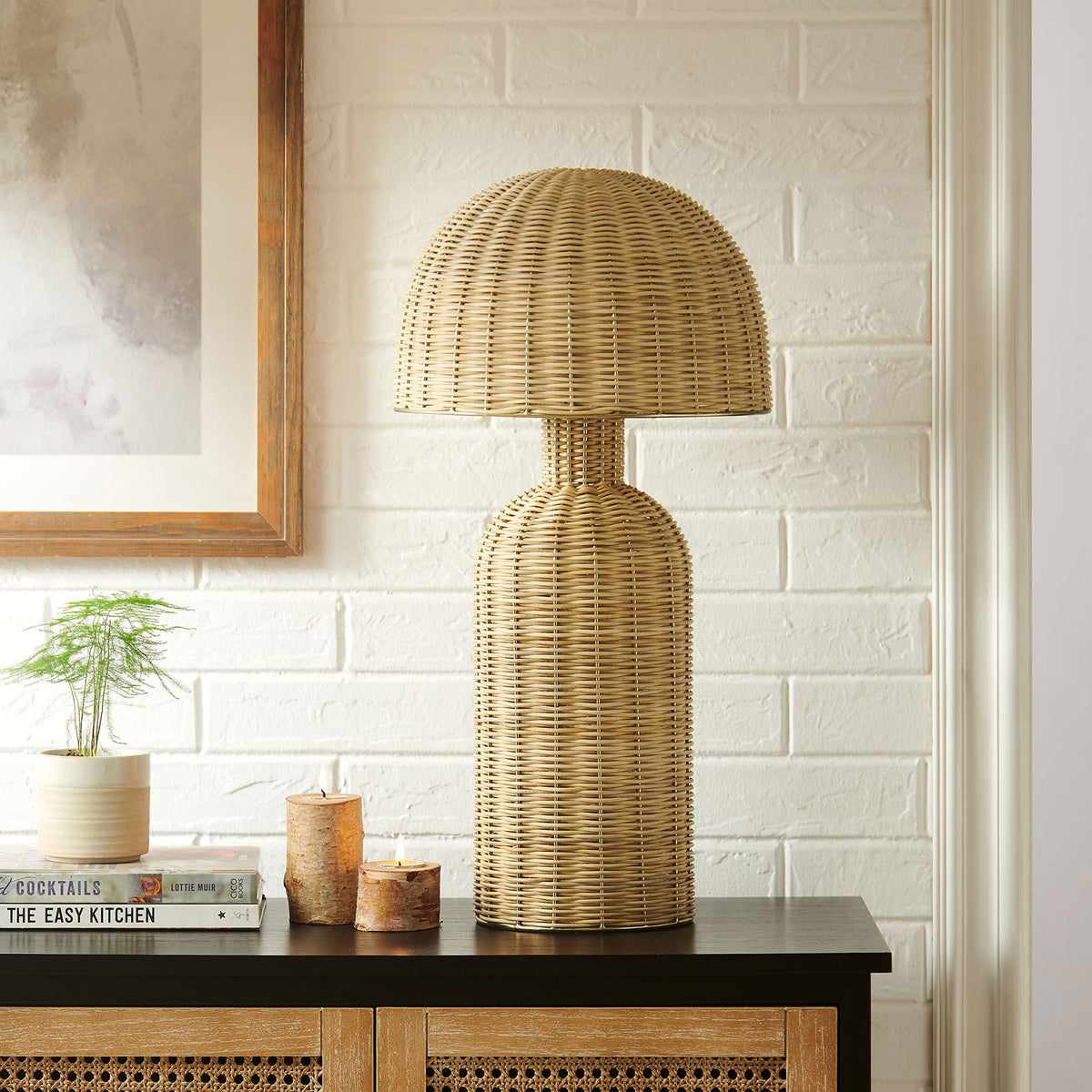 Natural rattan table lamp styled on a console table for a relaxed coastal look || EEI-7191-NAT || front_room