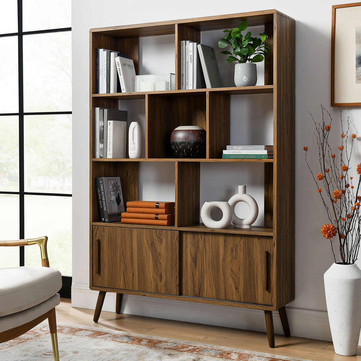 Elevates decor with spacious display cubbies and tidy sliding-door storage || EEI-7193-WAL || front_angle_room