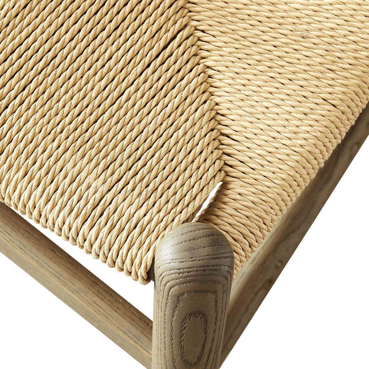 Woven paper rope seat on Amish gray wood dining chair showing intricate diagonal weave and smooth wood frame || EEI-7200-GRY || detail_studio