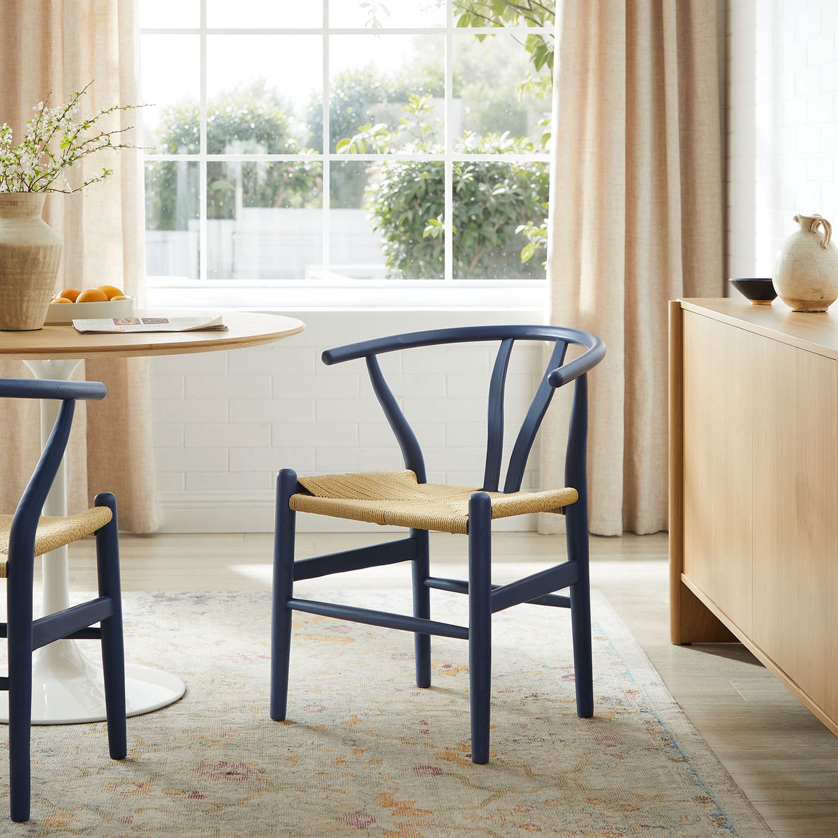 Midnight blue Amish dining chair adding contrast to a light, airy dining room with soft neutral tones. || EEI-7200-MID || front_angle_room