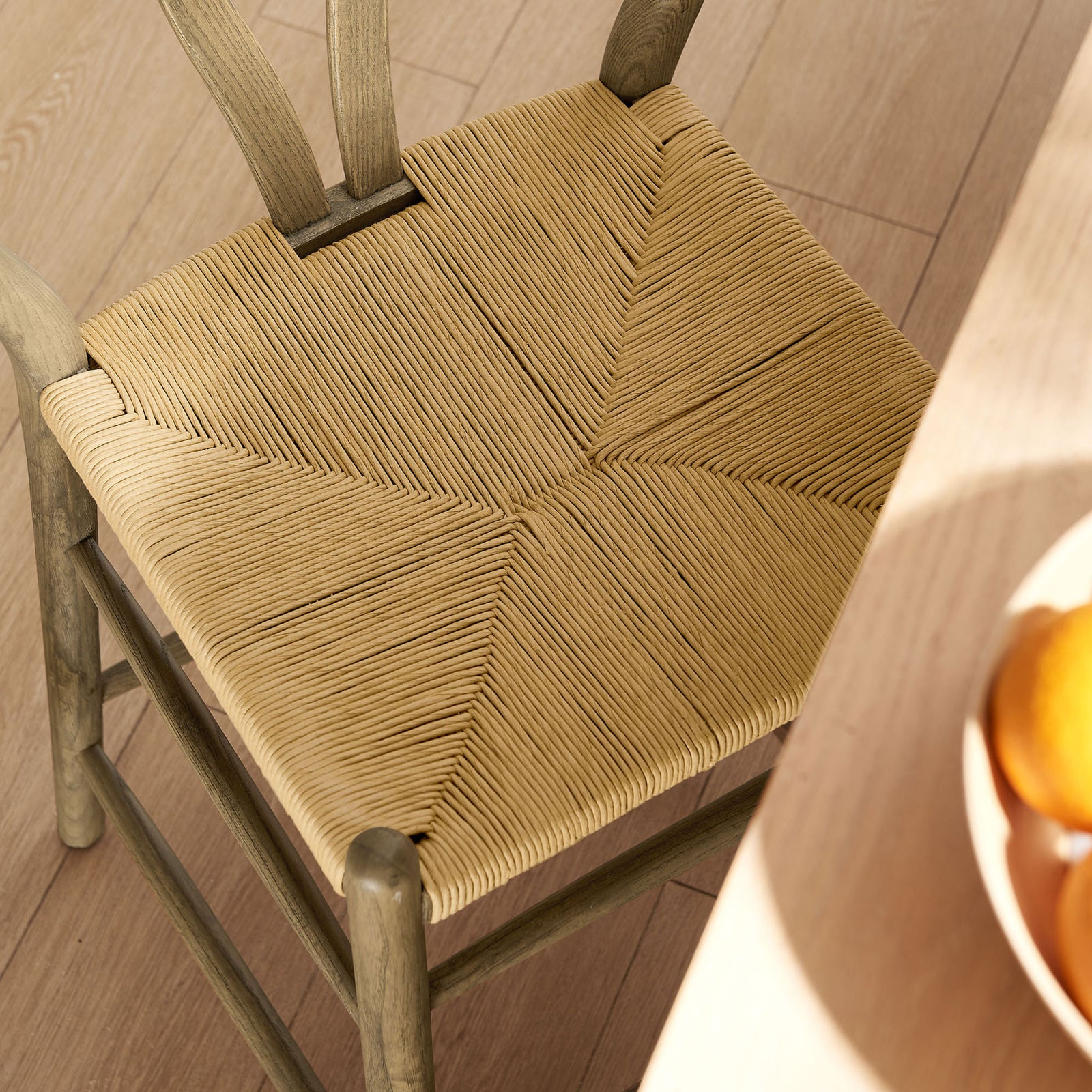 Textured paper rope seat adds natural contrast against the weathered gray wood frame || EEI-7206-GRY || detail_room