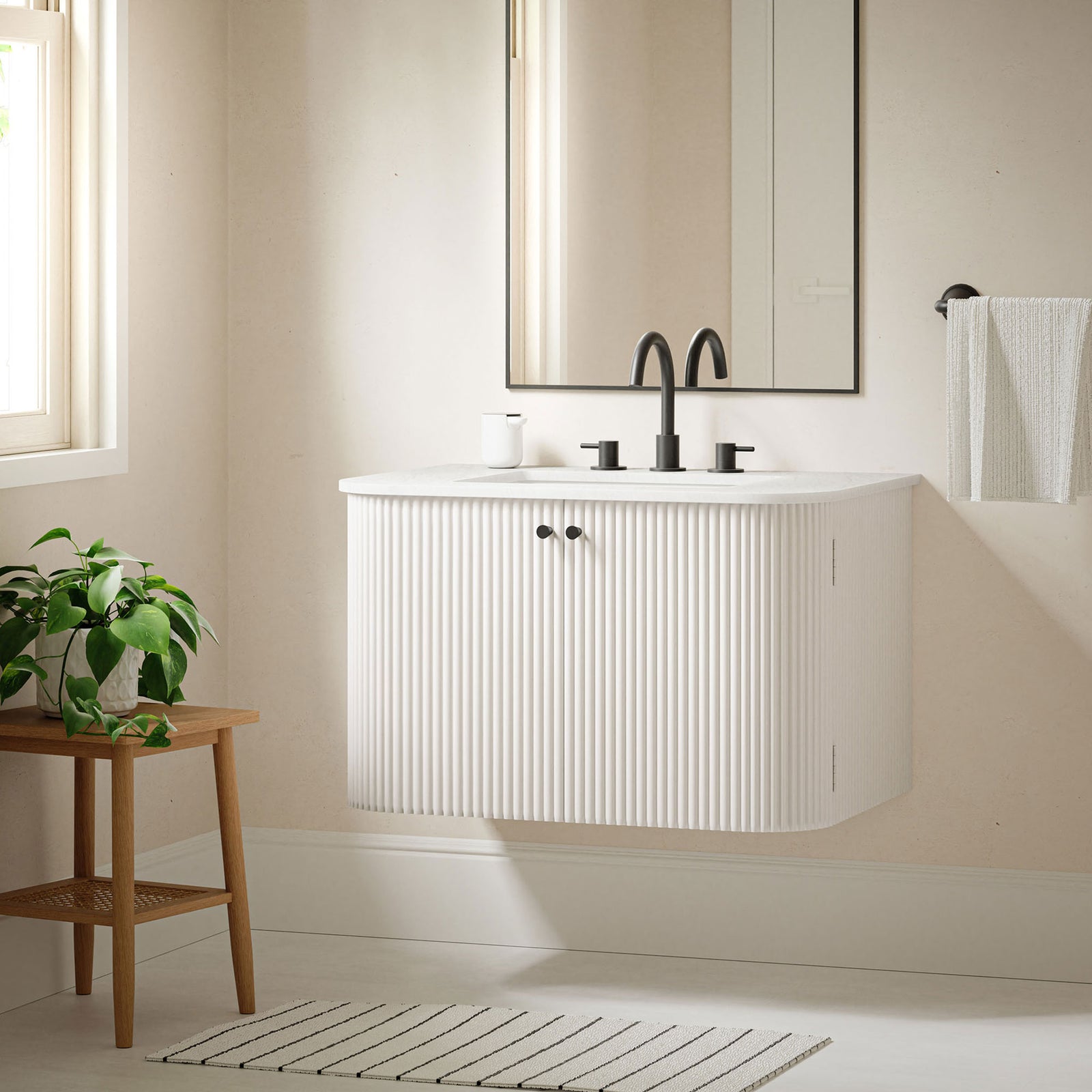 Floating vanity maximizes floor clearance and visual space || EEI-7208-IVO || front_angle_room