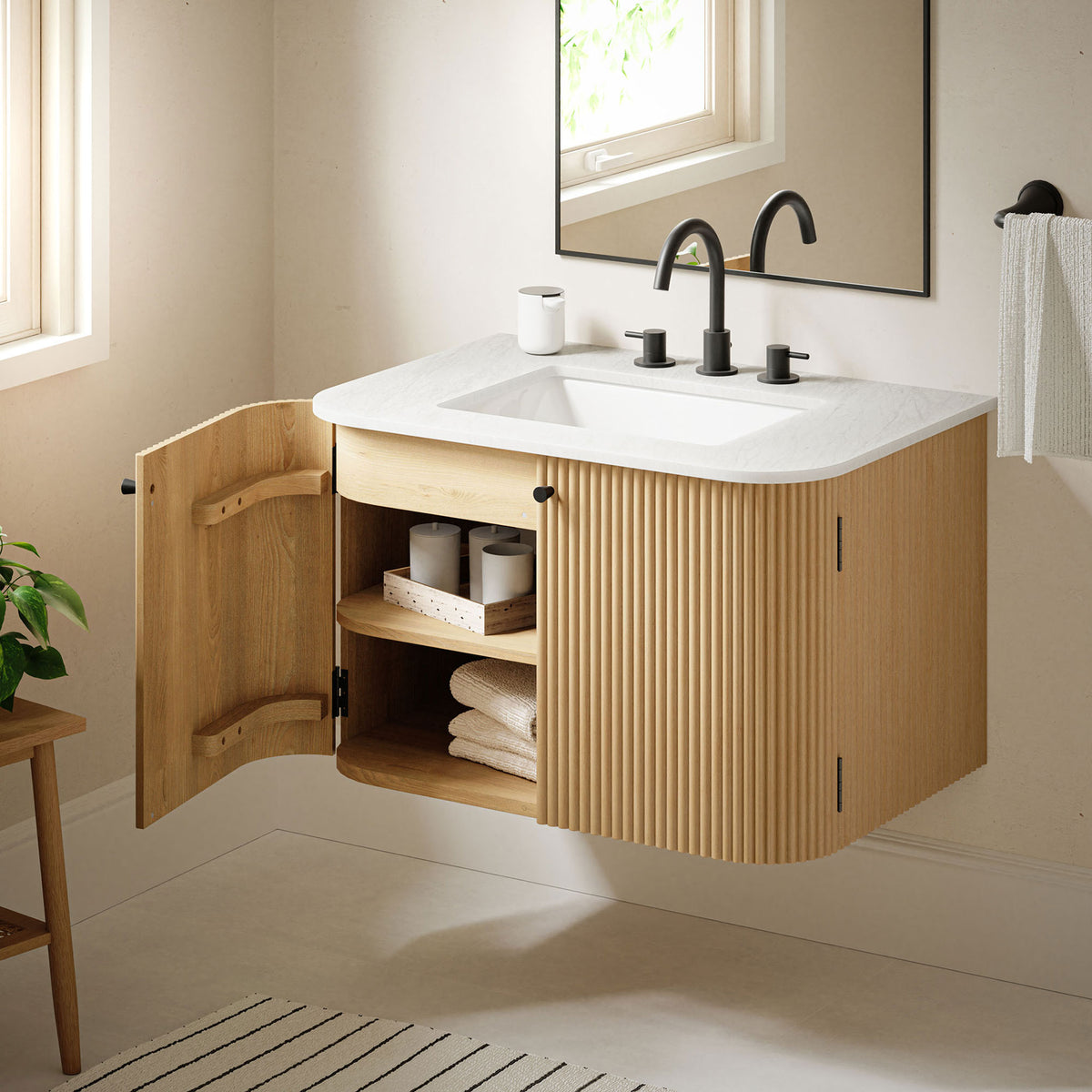 Floating vanity with open door displaying baskets and folded towels || EEI-7208-NAT || front_angle_open_room