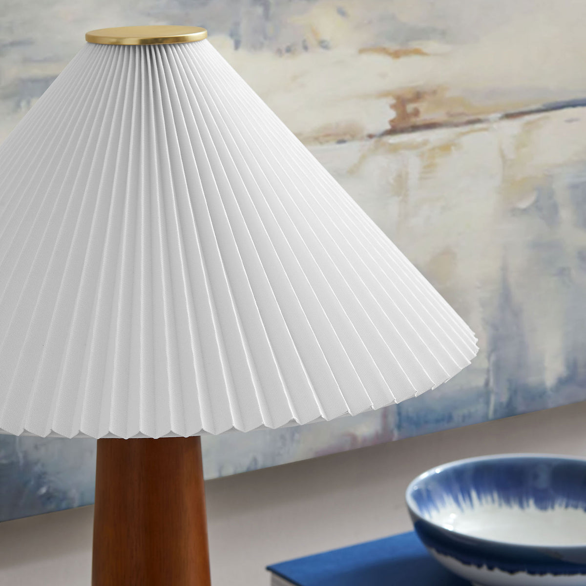 Pleated lamp shade styled on a console with artwork for a serene modern look || EEI-7212-WAL || shade_room