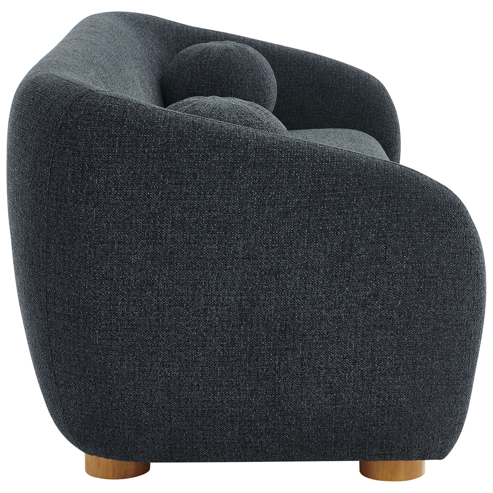Side view of the Holland navy sofa showing its smooth curved profile and low wood bun feet. || EEI-7217-NAV || side_studio