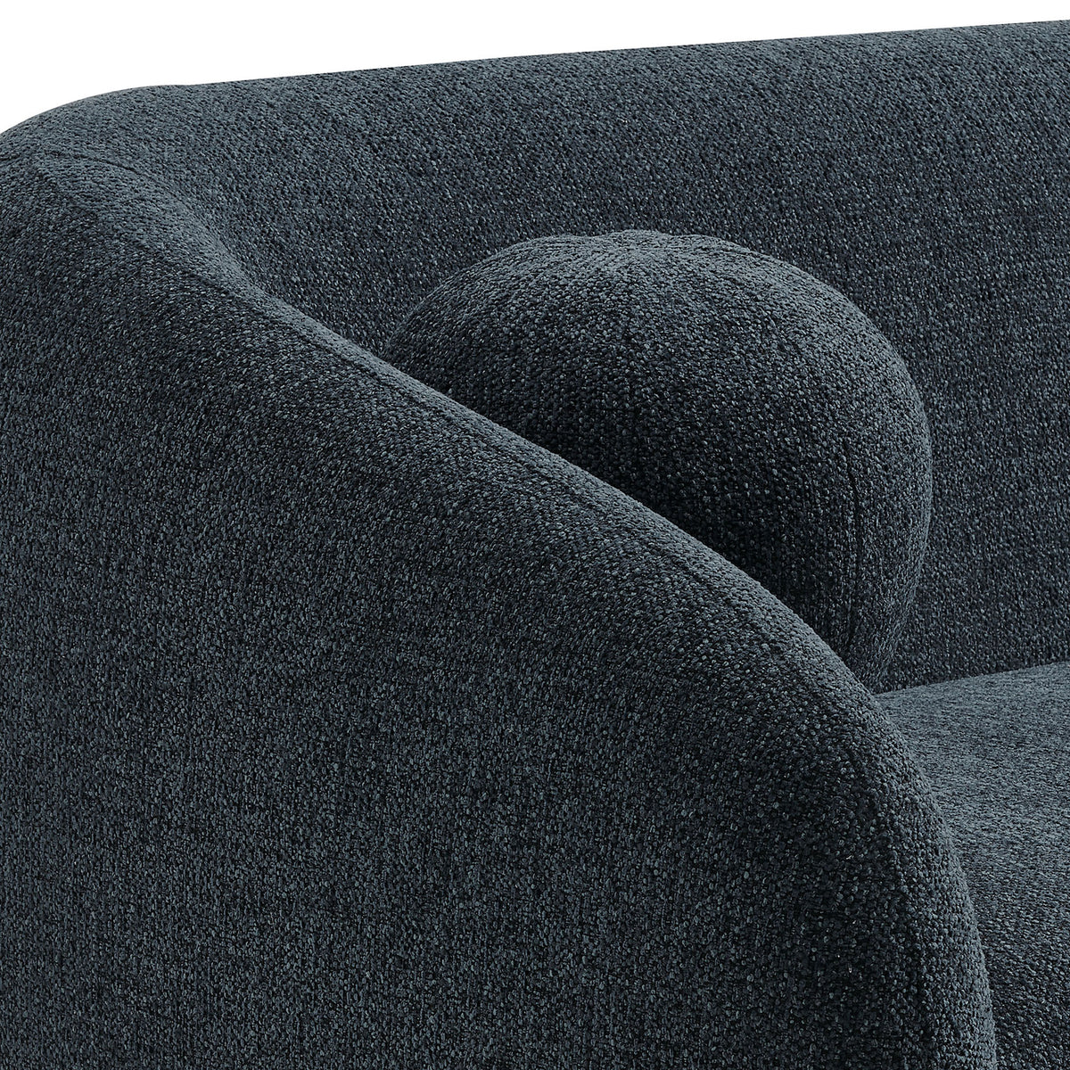 Close-up of the curved arm and round accent pillow showing the textured navy chenille fabric. || EEI-7217-NAV || detail_studio
