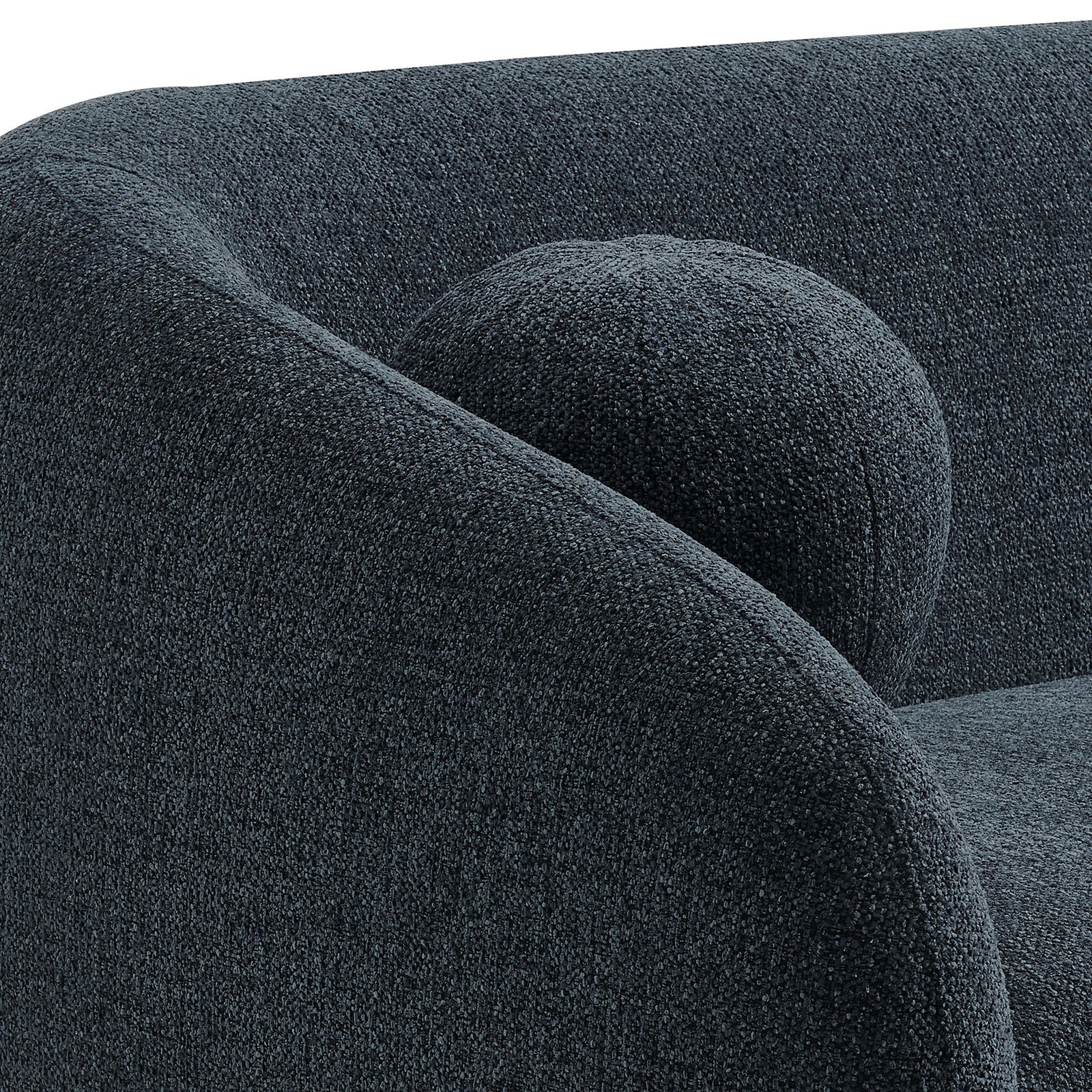 Close-up of the curved arm and round accent pillow showing the textured navy chenille fabric. || EEI-7217-NAV || detail_studio