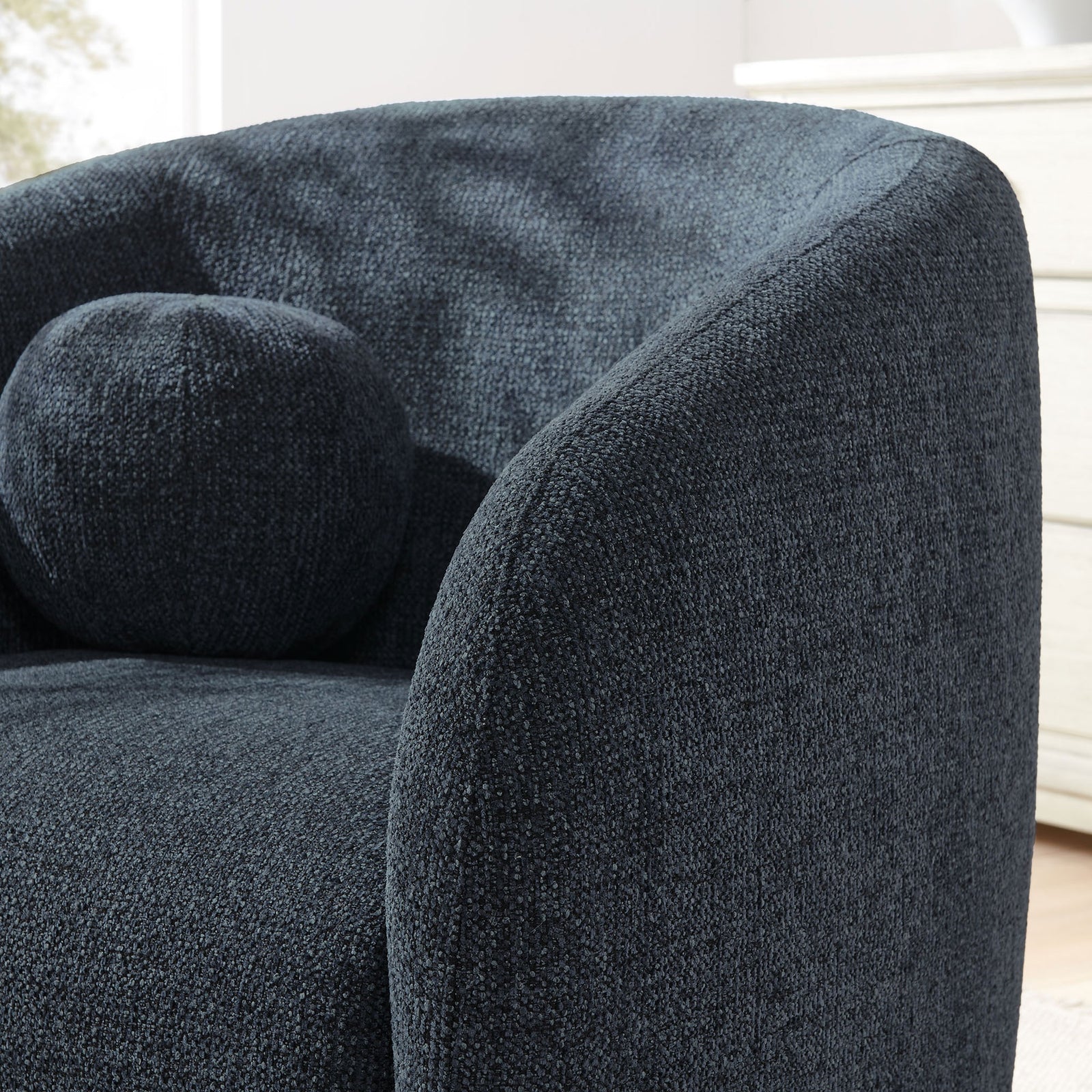Soft boucle-inspired texture and rounded arm design with the matching ball pillow || EEI-7218-NAV || detail_room