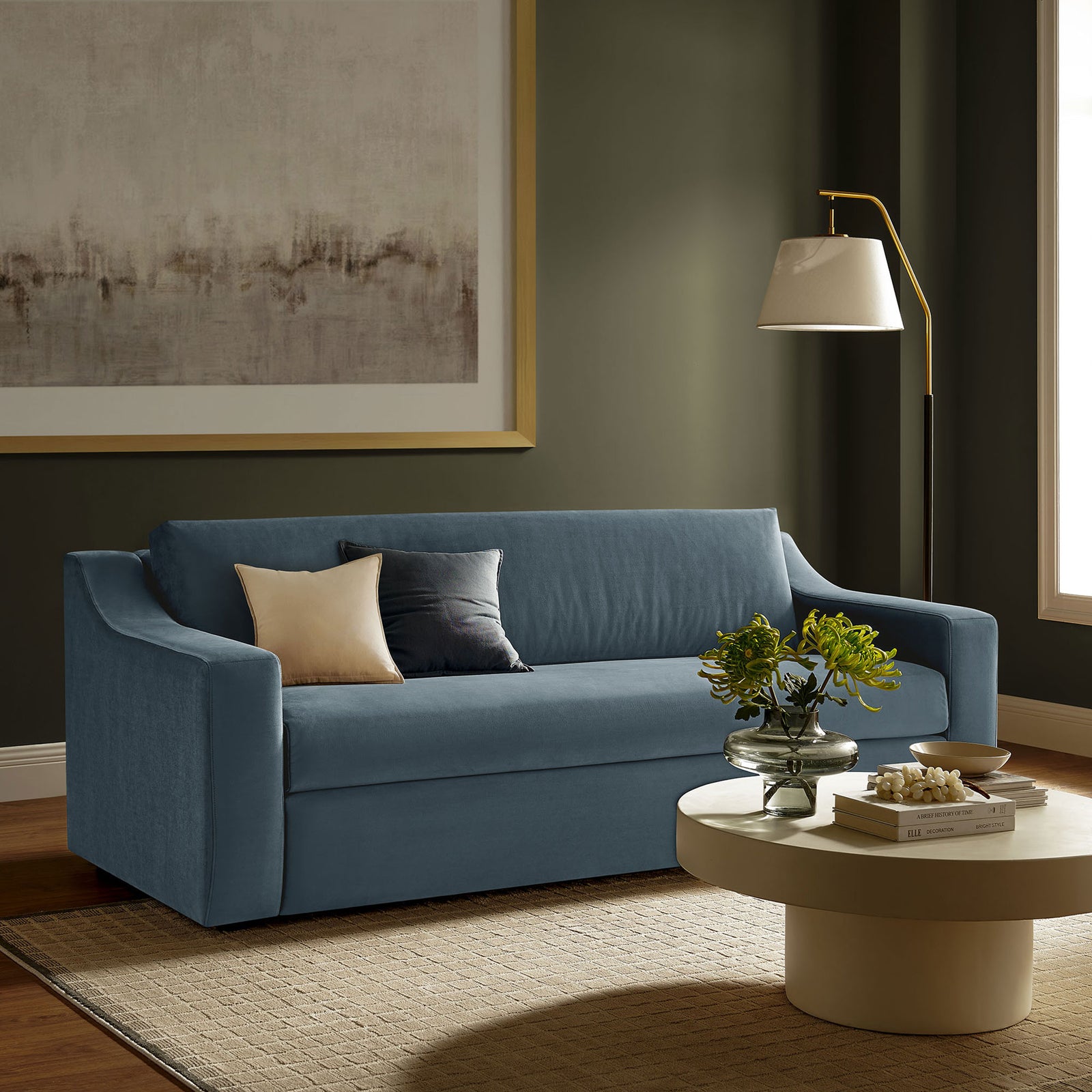 Cadet blue velvet sofa anchored in a warm living room with modern coffee table and floor lamp || EEI-7219-CAB || front_angle_room