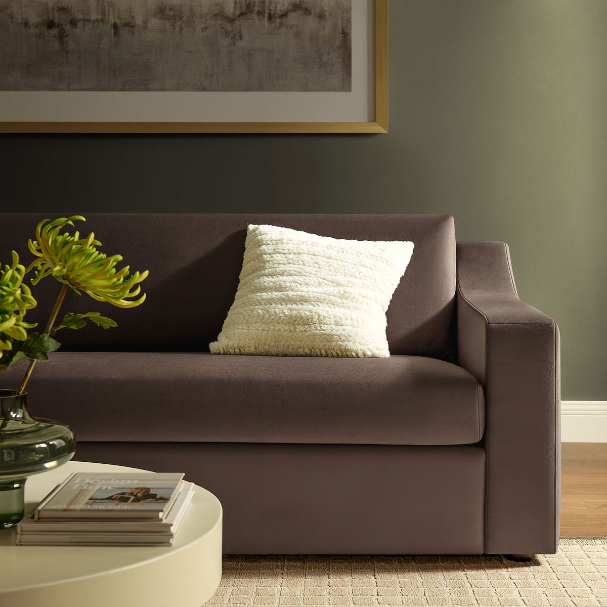 Chocolate brown velvet sofa styled with a textured white pillow in a cozy living room vignette || EEI-7219-CHB || detail_room