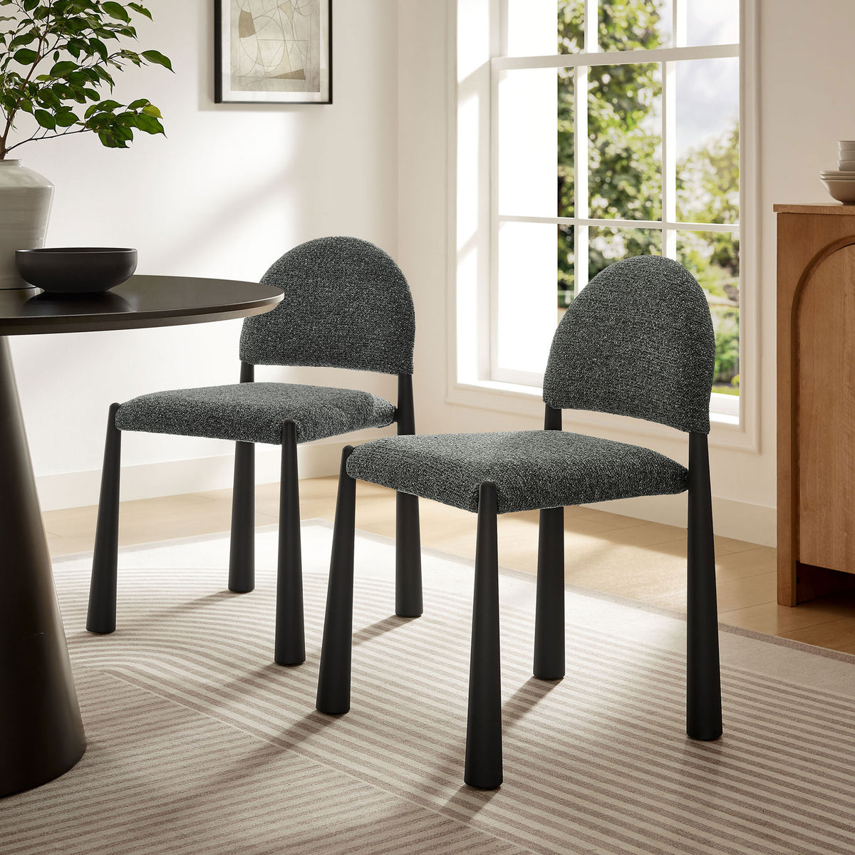 Pair of black anthracite boucle dining chairs elevating a bright modern dining room setting. || EEI-7220-BLK-ANT || front_angle_room