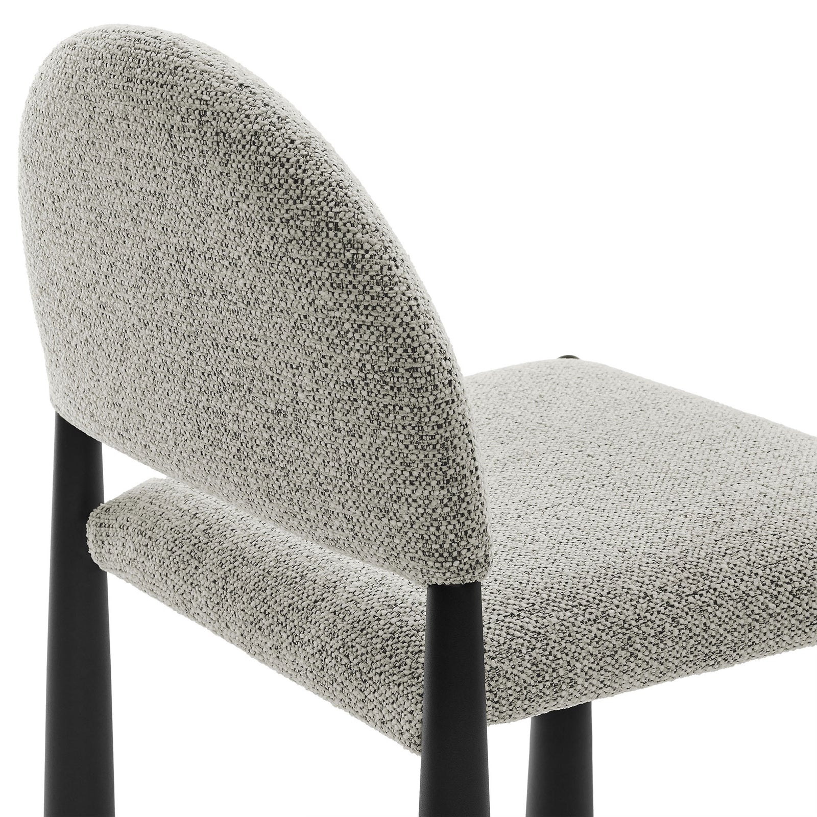Textured boucle-style upholstery and neatly tailored seams on the arched back and seat of the Hayley chair || EEI-7220-BLK-CAM || detail_studio