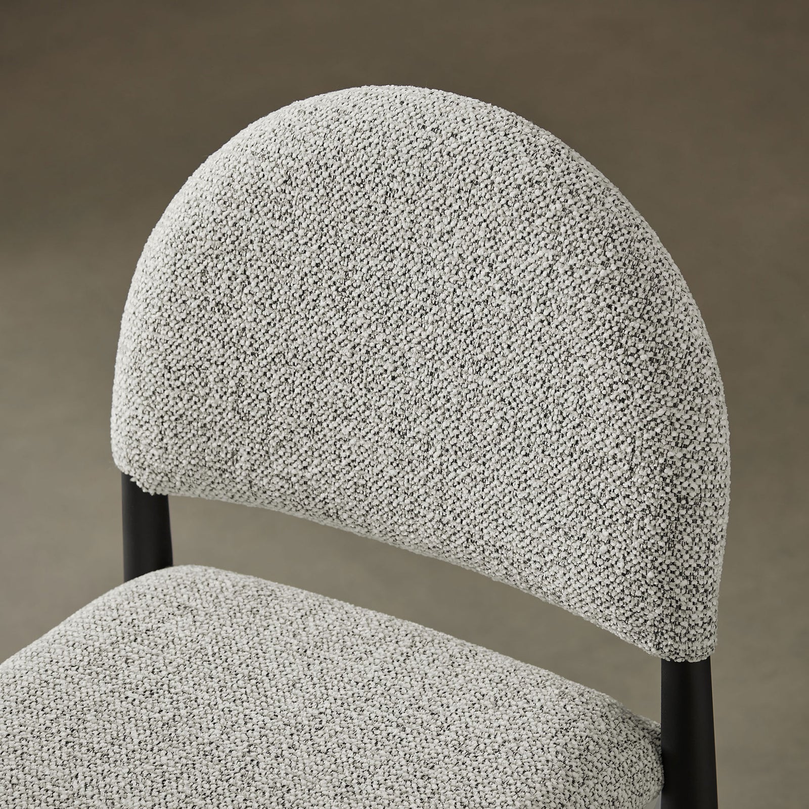 Boucle-style fabric offers inviting texture and a cozy feel against the curved back || EEI-7221-BLK-CAM || detail_room