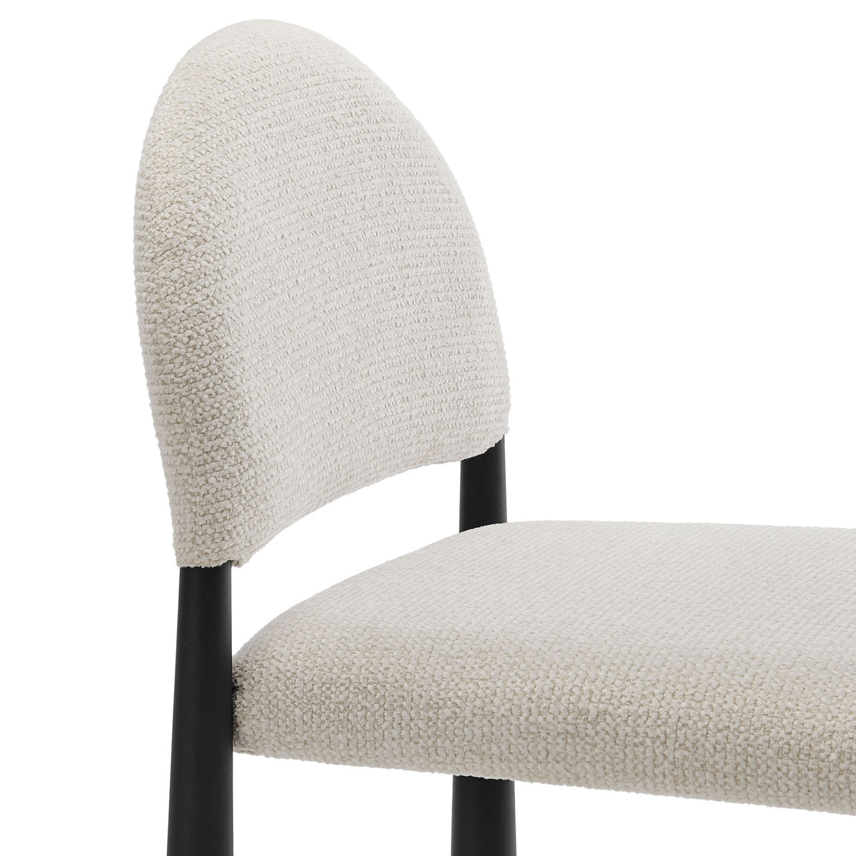 Textured boucle upholstery and a softly rounded backrest offer inviting comfort and visual depth || EEI-7221-BLK-CRE || detail_studio