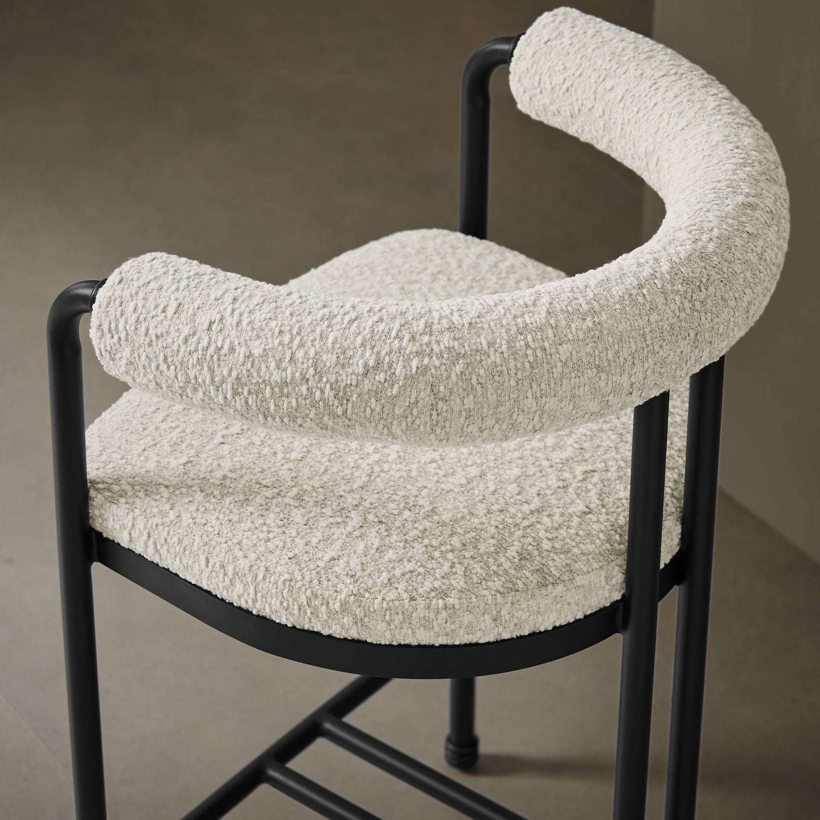 Cozy boucle texture and sculpted rolled back add warmth to a refined modern space || EEI-7226-BLK-PRL || detail_room