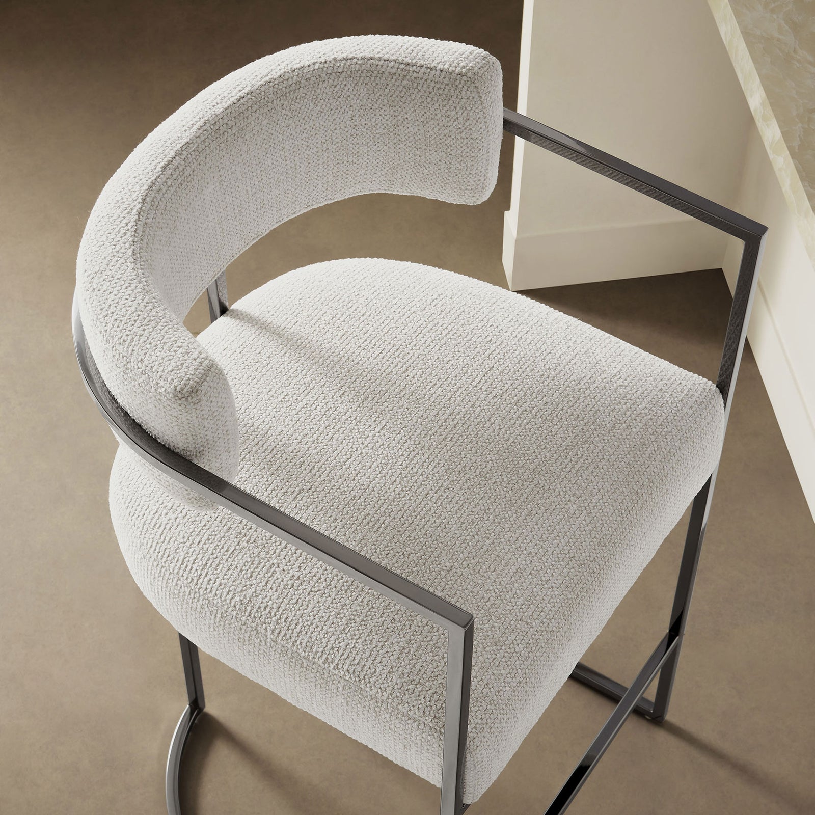 Curved barrel back and nubby textured seat create a cozy, elevated perch at the counter. || EEI-7227-SLV-CRE || detail_room