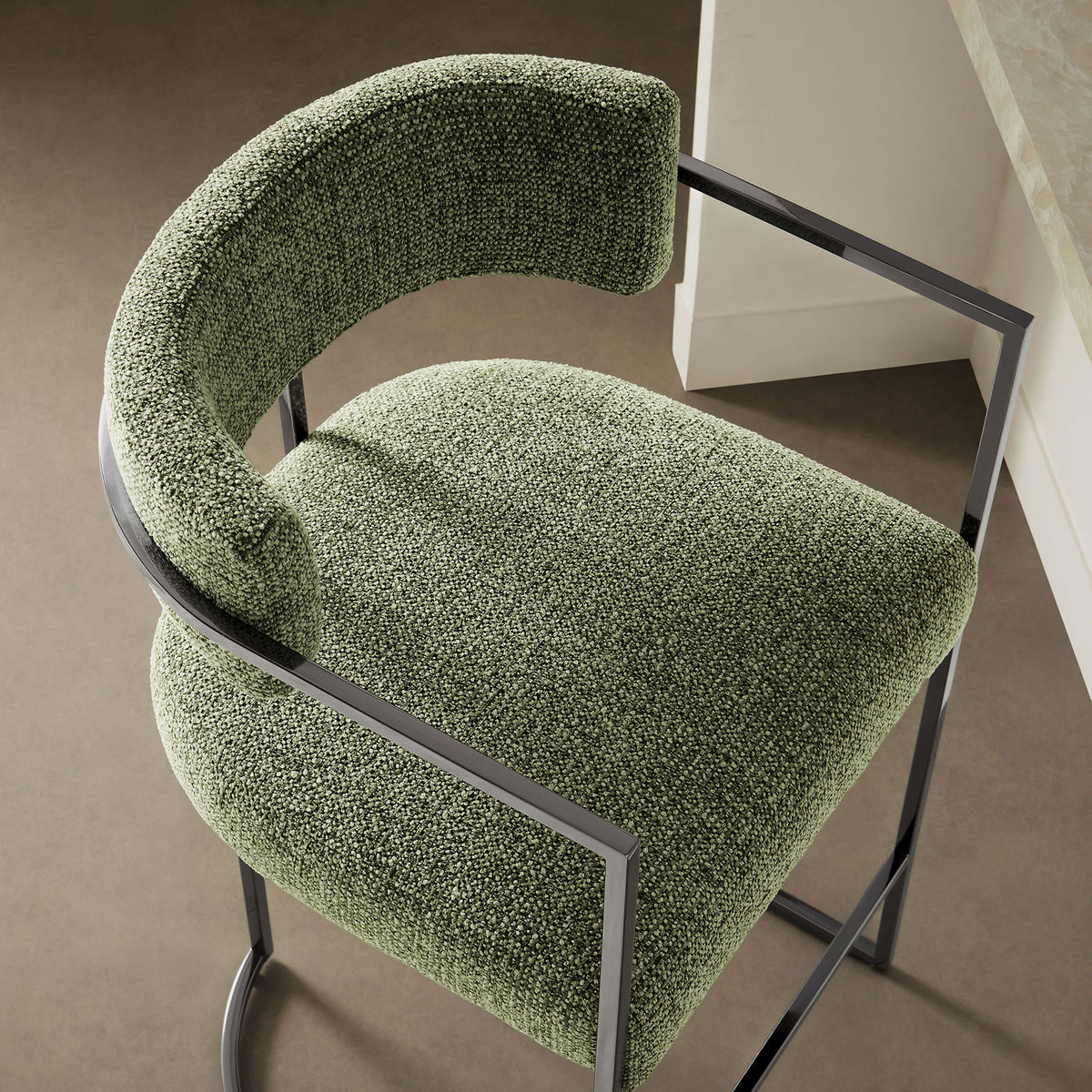 Nubby green seat and curved back offer inviting texture and support at the counter || EEI-7227-SLV-LEA || detail_room