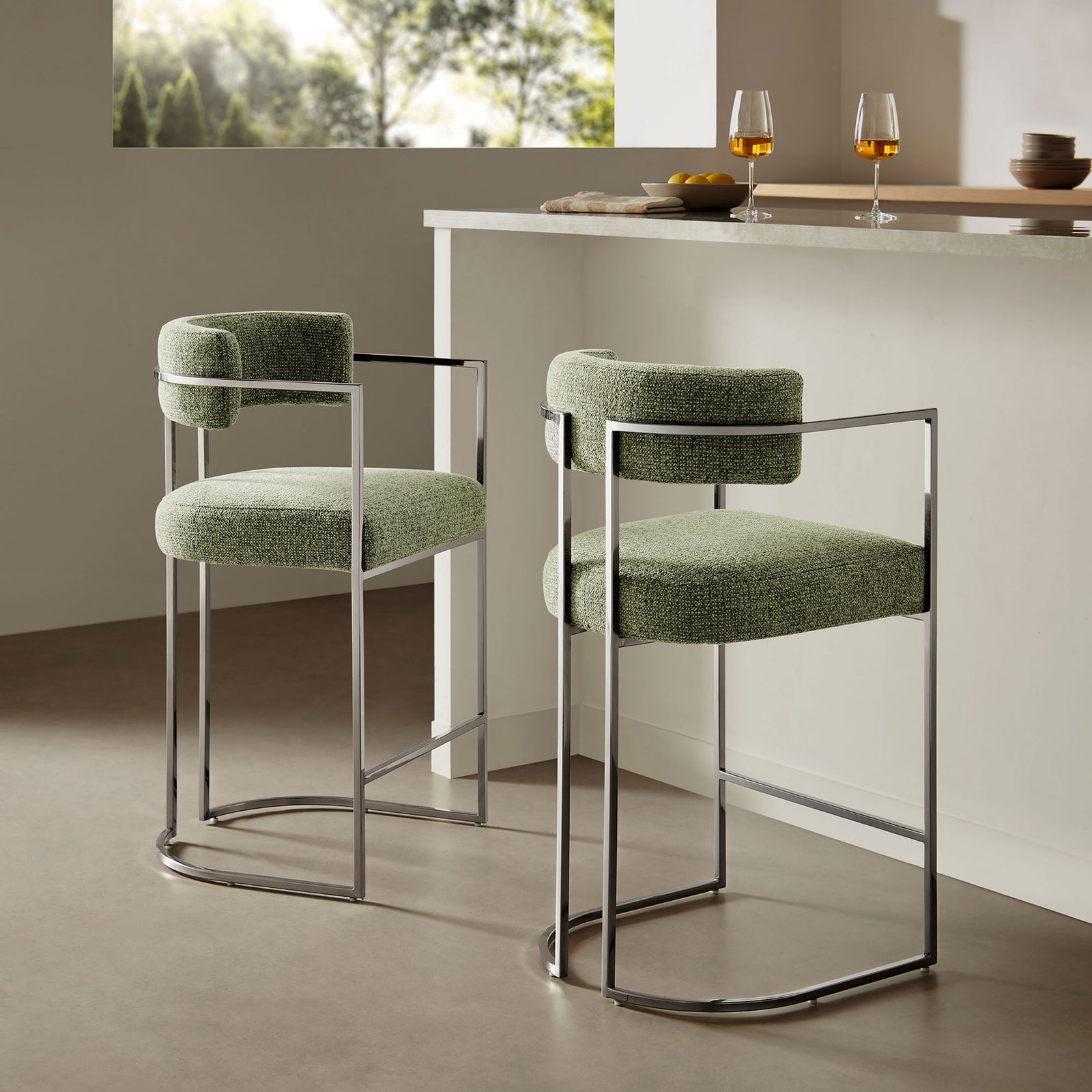 Sleek counter stool brings modern polish to a kitchen island with green fabric and chrome frame || EEI-7227-SLV-LEA || front_angle_room