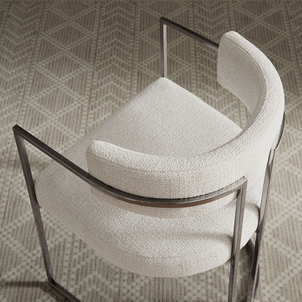 Overhead view of barrel-back chair in silver cream fabric styled on a patterned area rug || EEI-7228-SLV-CRE || top_room