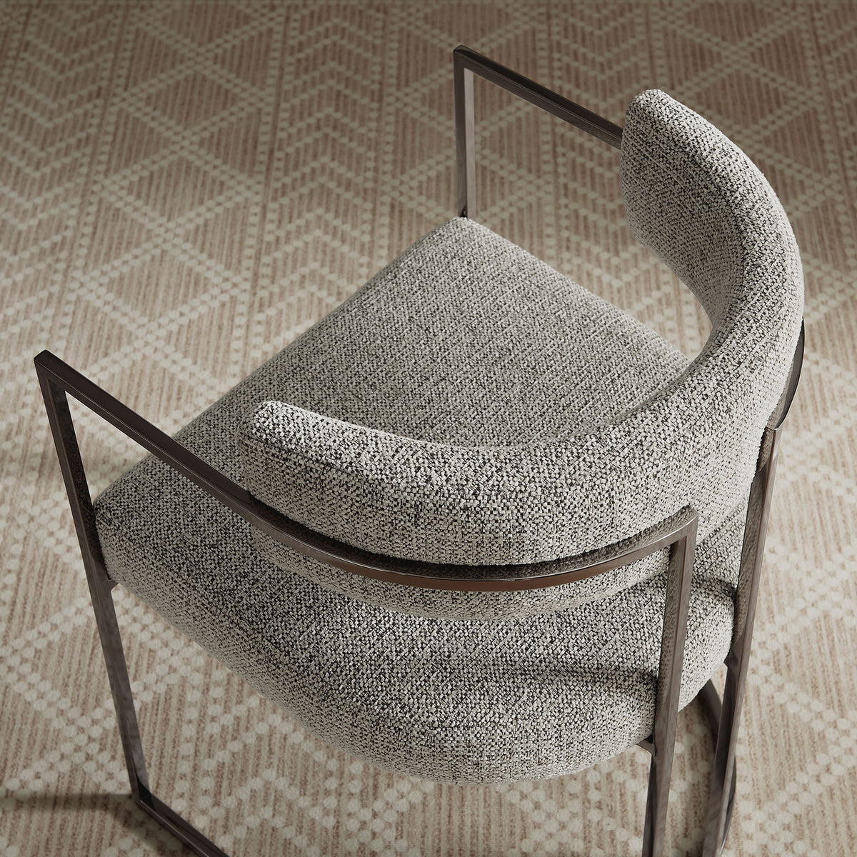 Huron dining chair in Silver Wheat upholstery styled on a patterned area rug || EEI-7228-SLV-WHE || top_angle_room