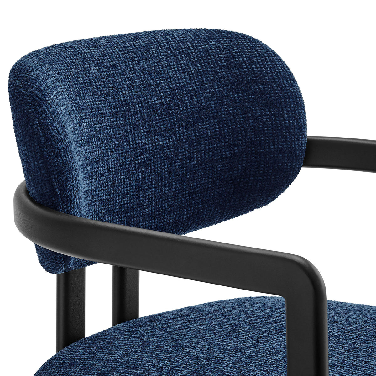 Textured navy upholstery and rounded barrel back cushion contrasted with the smooth black metal frame. || EEI-7229-BLK-NAV || detail_studio