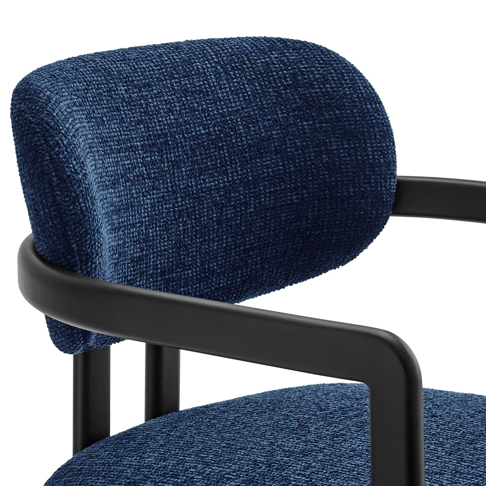 Textured navy upholstery and rounded barrel back cushion contrasted with the smooth black metal frame. || EEI-7229-BLK-NAV || detail_studio