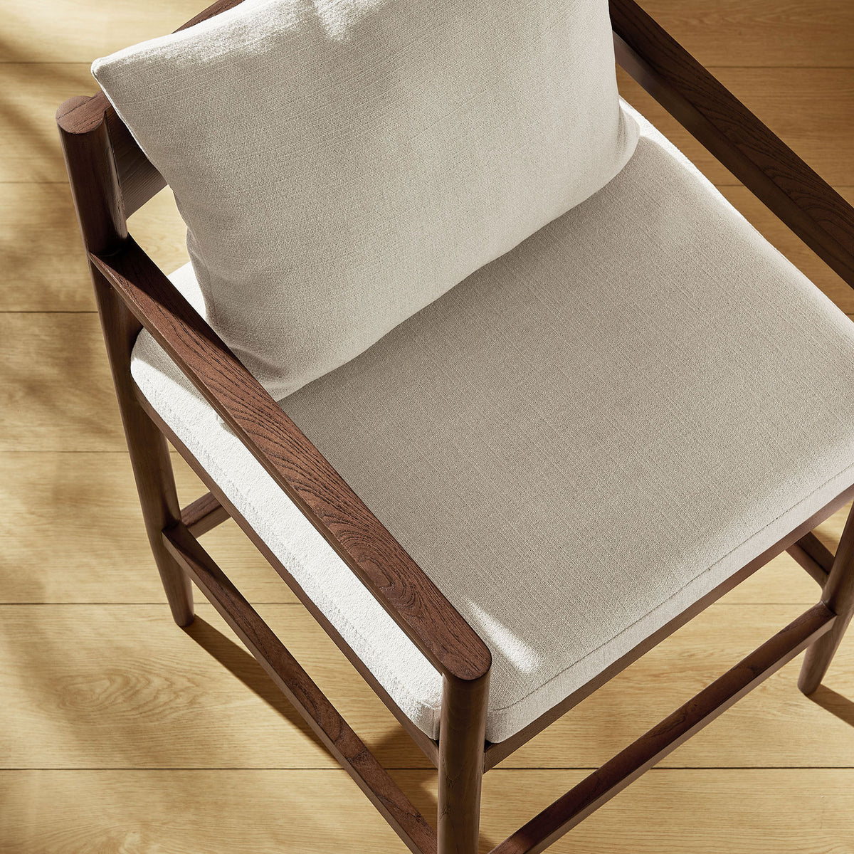 Soft slub fabric and sculpted wood arms add inviting texture to the kitchen || EEI-7244-SAL || detail_room