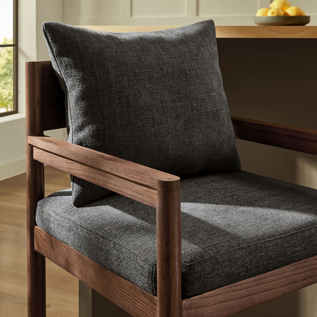 Textured charcoal pillow and seat pair with warm wood for a cozy, contemporary look. || EEI-7245-CHA || detail_room