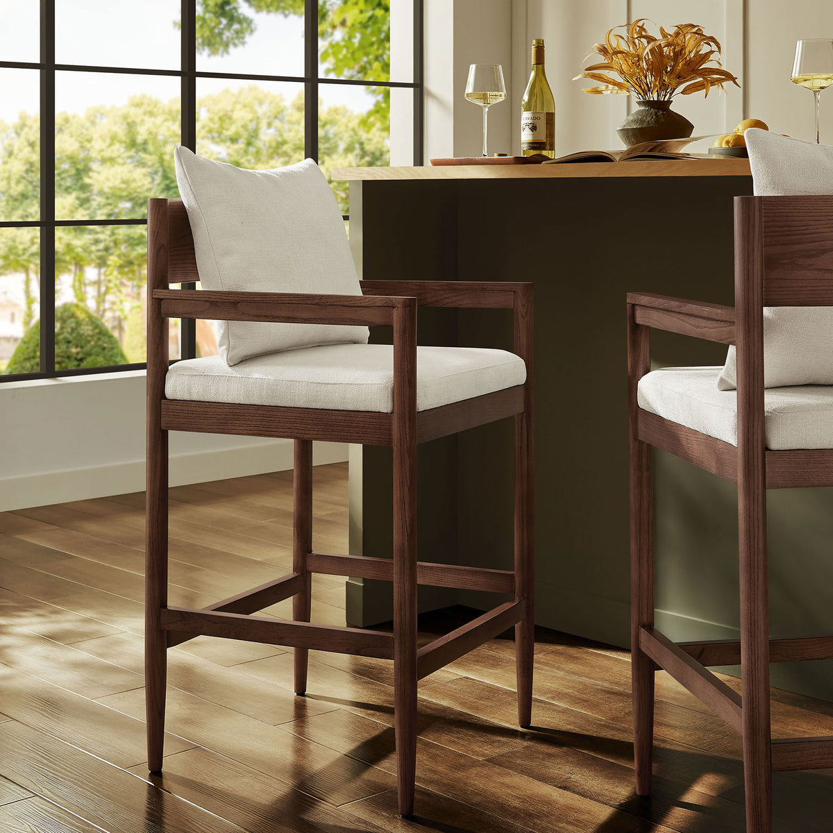 Elevated bar seating brings Scandinavian-inspired warmth with rich wood, plush cushions, and an open-back design || EEI-7245-SAL || front_angle_room