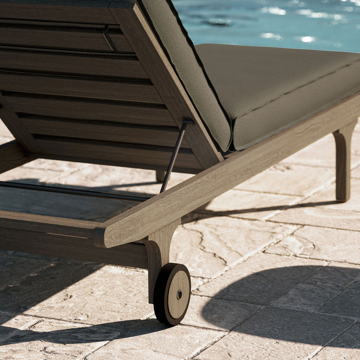 Teak chaise corner and wheel beside a sparkling pool for relaxed outdoor lounging || EEI-7251-WGR-FLI || leg_room