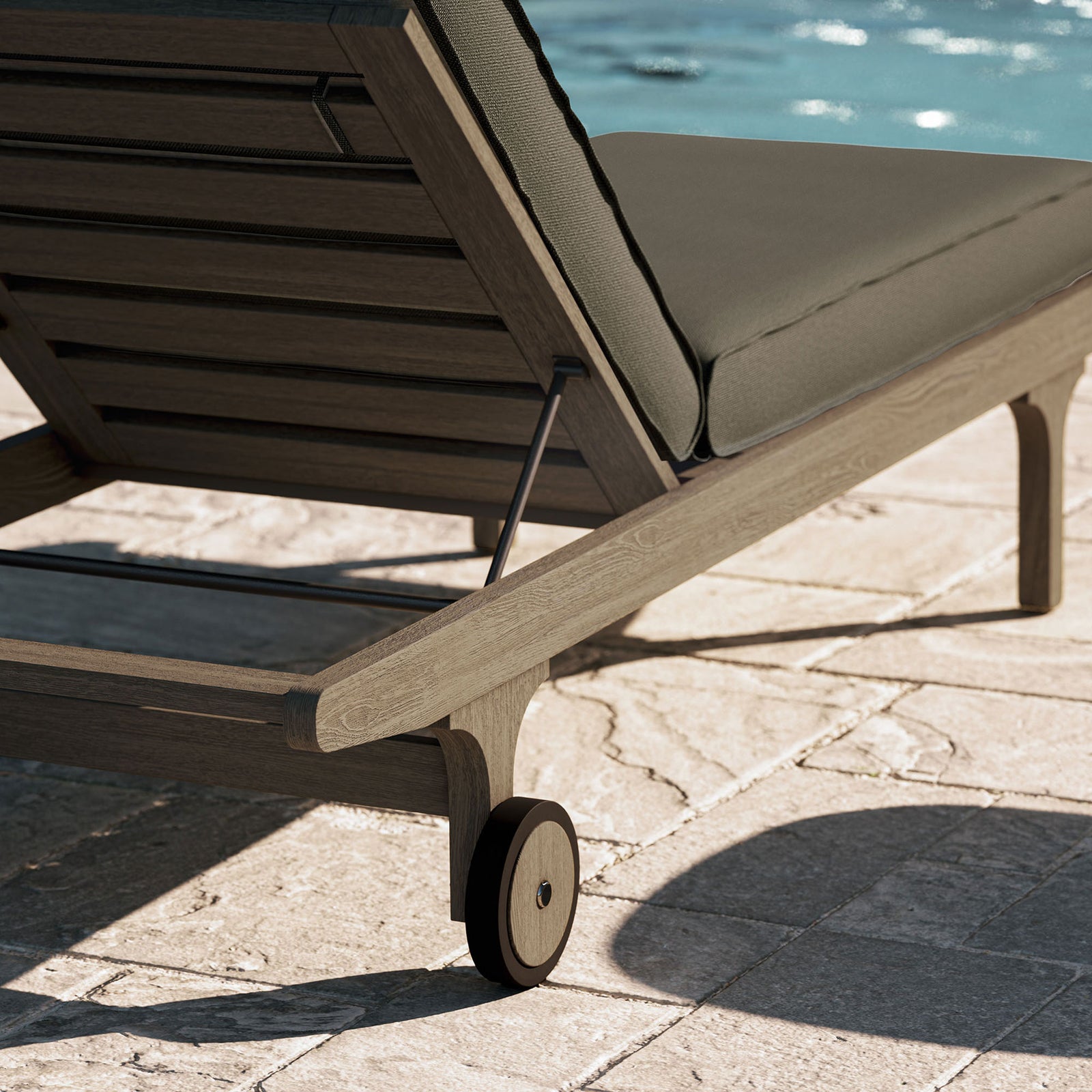 Teak chaise corner and wheel beside a sparkling pool for relaxed outdoor lounging || EEI-7251-WGR-FLI || leg_room