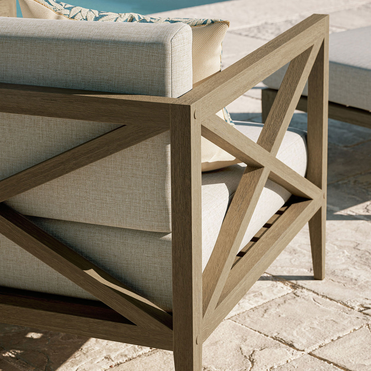 Warm-toned teak frame and pebble cushions shown in an outdoor setting, highlighting outdoor-ready materials || EEI-7252-WGR-PEB || detail_room