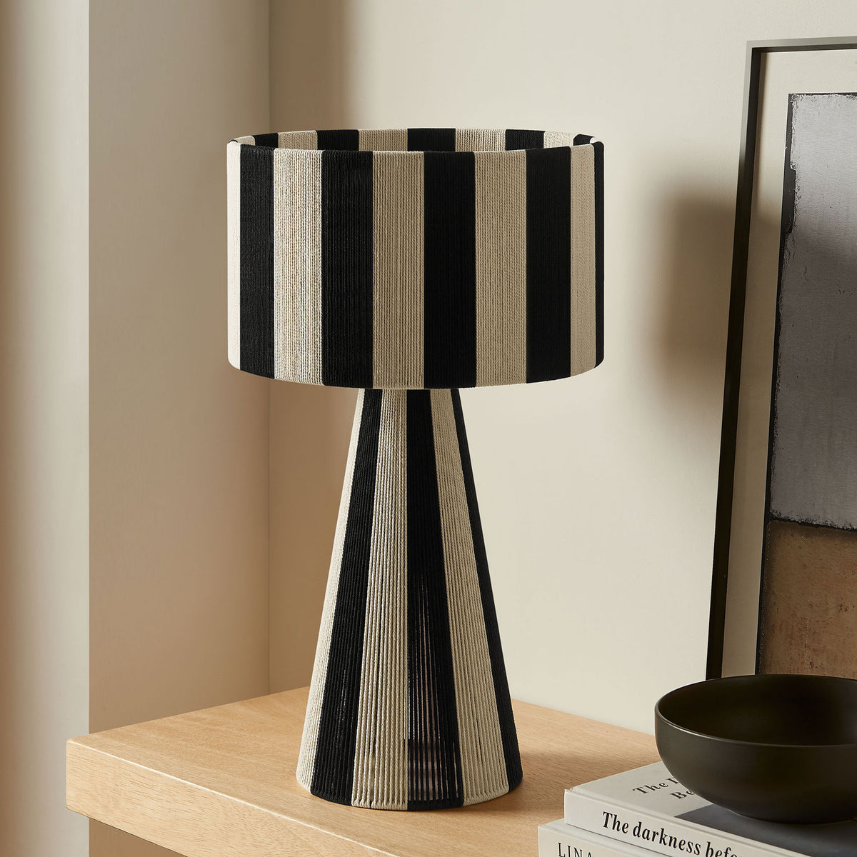 Renae striped table lamp in black and cream styles a clean console tabletop vignette. || EEI-7261-BLK || front_room