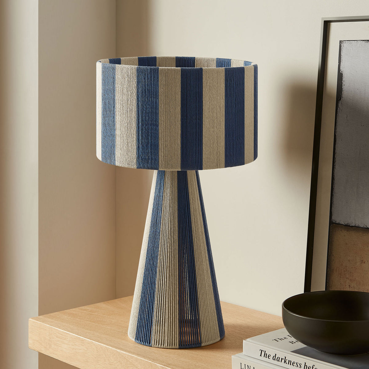 Renae capri blue striped table lamp accents a minimalist console surface in modern decor. || EEI-7261-CBL || front_room