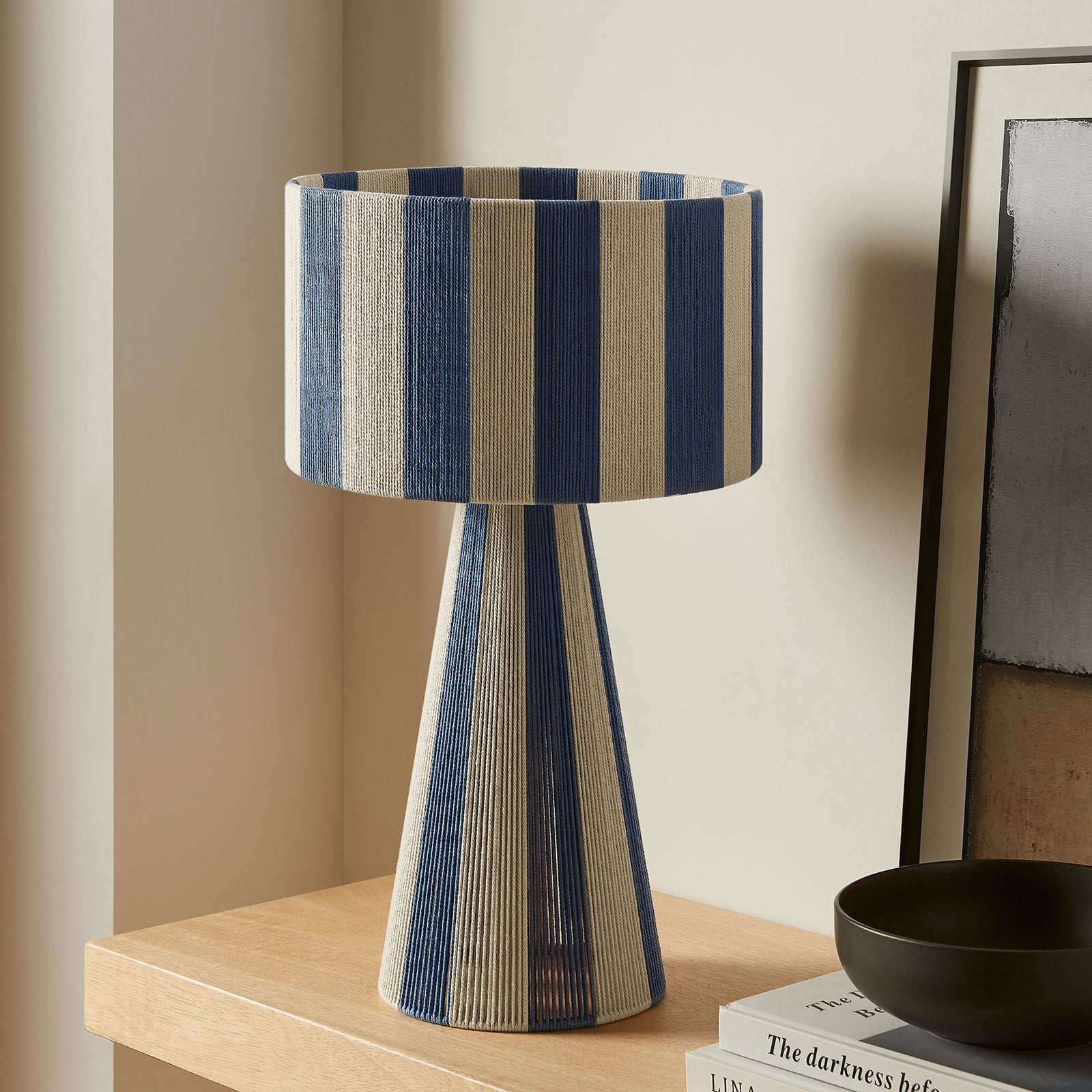 Renae capri blue striped table lamp accents a minimalist console surface in modern decor. || EEI-7261-CBL || front_room