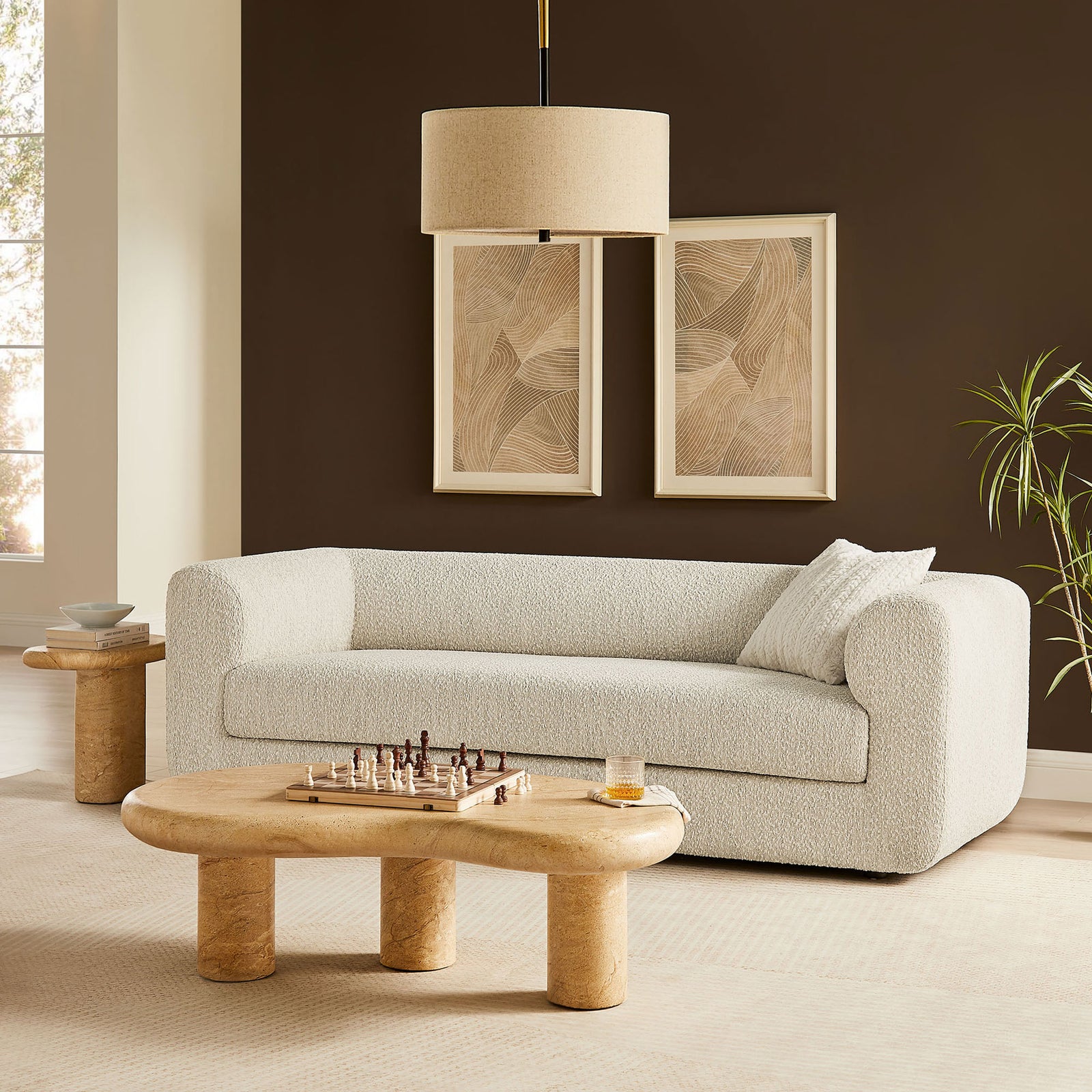 Modern pearl boucle sofa anchors a warm living room with sculpted tables and soft neutral decor || EEI-7280-PRL || front_angle_room