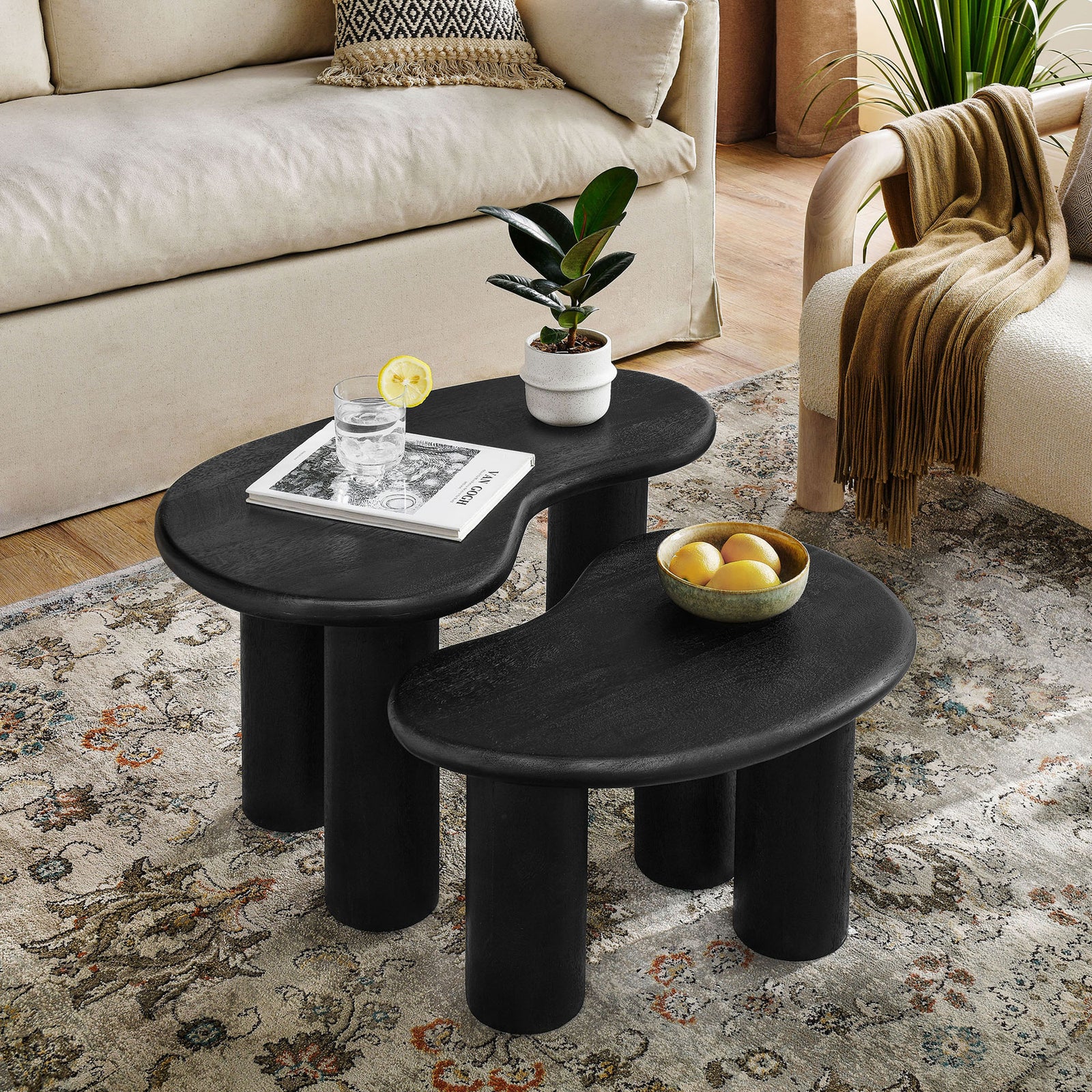 Compact nesting tables anchor the living room with organic curves and space-saving versatility || EEI-7283-BLK || front_angle_room