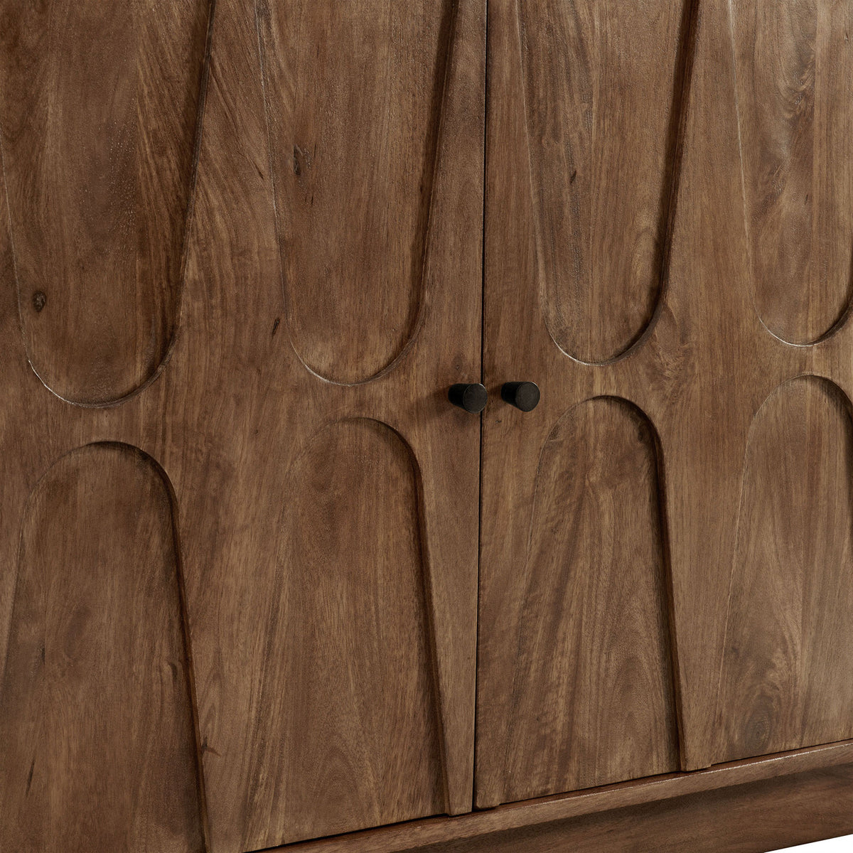 Sculpted mango wood cabinet doors accented by small matte black pulls || EEI-7285-WAL || handle_studio