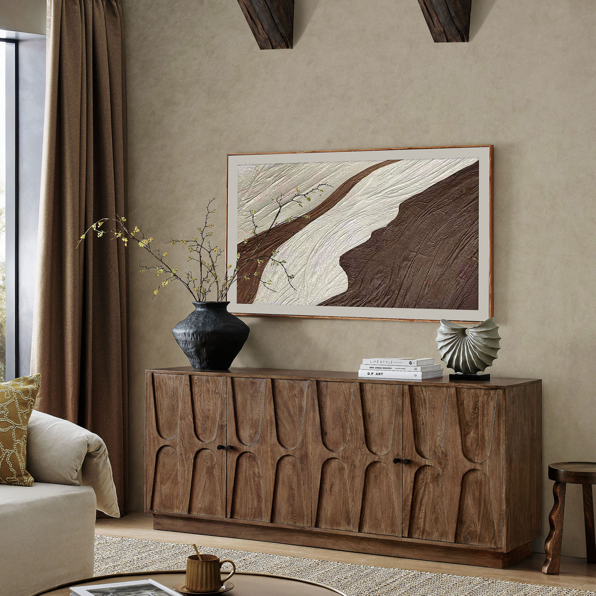 Walnut mango wood sideboard styled in a warm living room with art and decor highlighting its sculpted doors || EEI-7285-WAL || front_angle_room