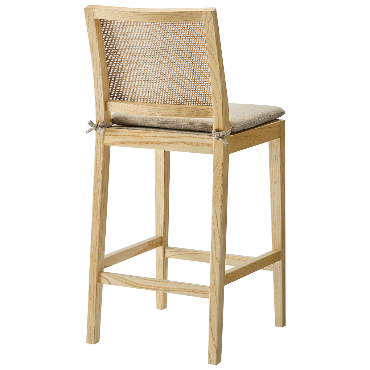 Curved rattan backrest and neatly tied cushion add texture and charm to this counter stool. || EEI-7290-NAT-BEI || back_angle_studio
