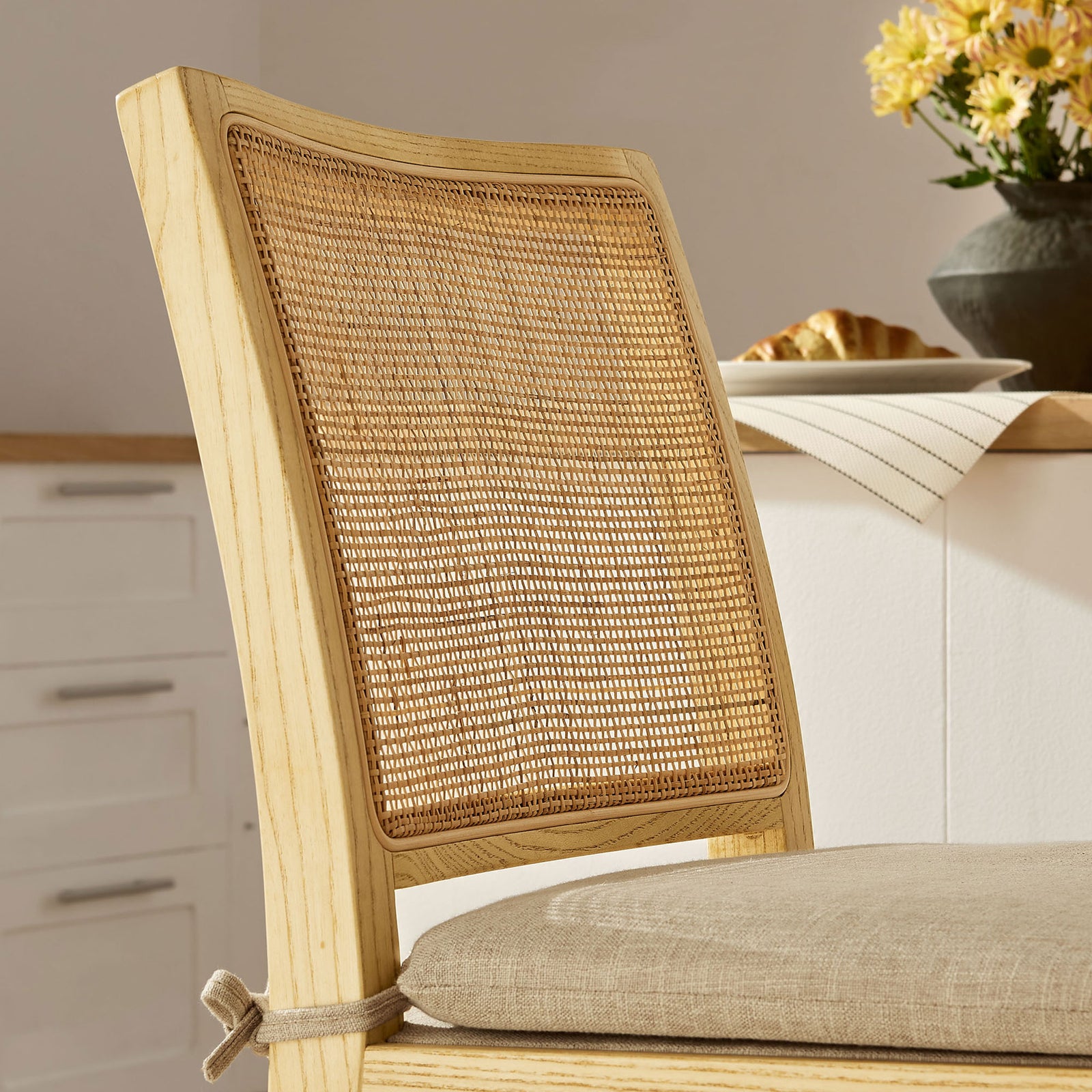Textured rattan back pairs with a soft beige cushion to elevate casual seating. || EEI-7290-NAT-BEI || detail_room