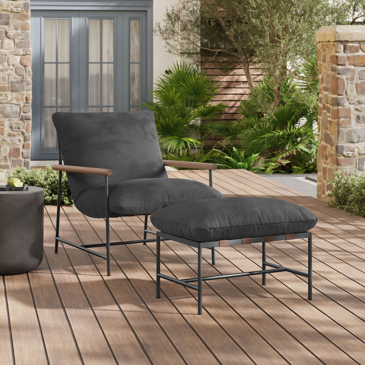 Charcoal boucle lounge chair and ottoman creating a cozy retreat on a modern outdoor deck || EEI-7292-CHA || front_angle_room