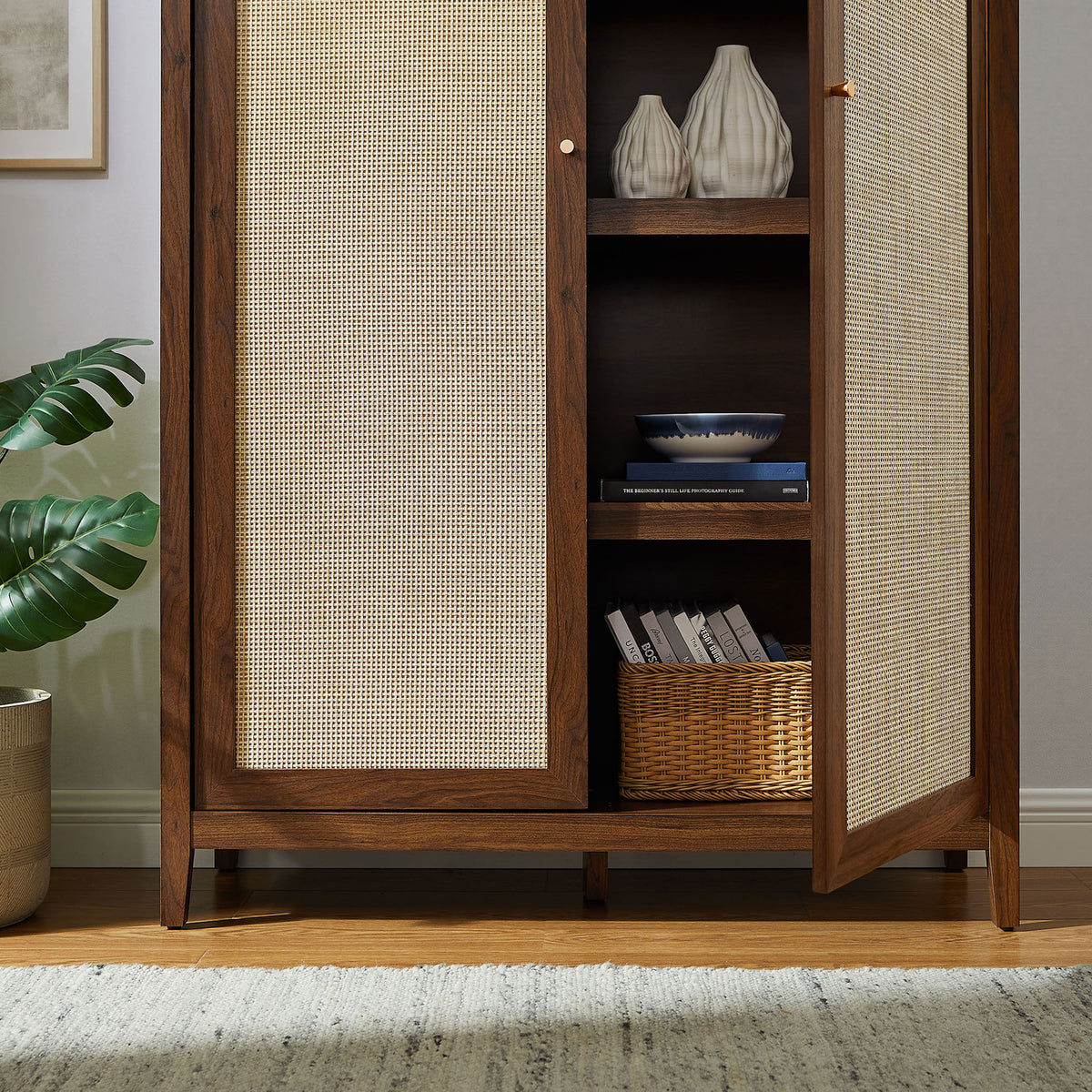 Styled walnut cabinet with open door showcasing decor pieces and basket on interior shelving || EEI-7294-WAL || storage_open_room