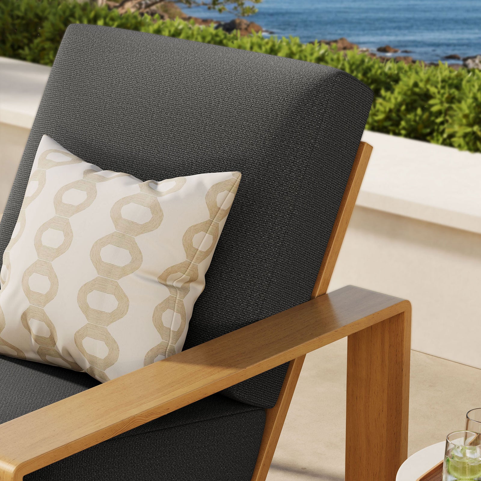 Charcoal cushion and faux wood arm detail bring modern warmth to an inviting outdoor retreat || EEI-7296-CHA-NAT || detail_room
