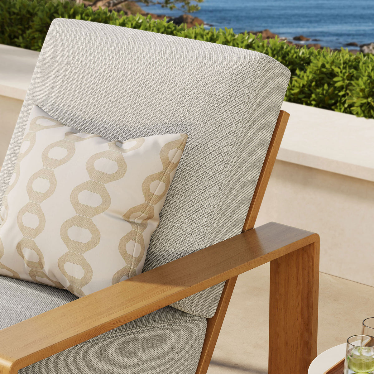Ivory cushion and faux wood arm detail bring airy warmth to an inviting outdoor retreat || EEI-7296-IVO-NAT || detail_room