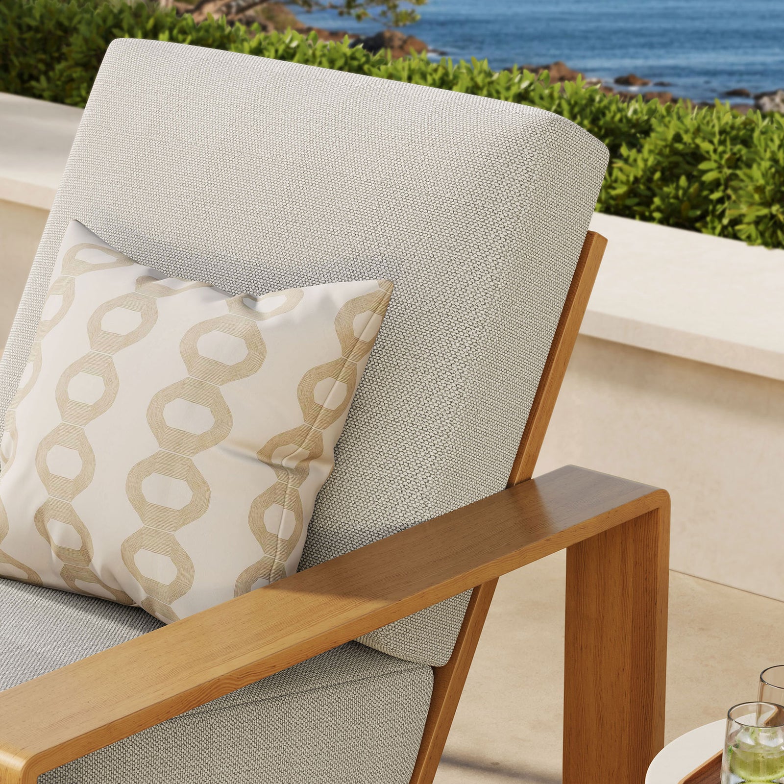 Ivory cushion and faux wood arm detail bring airy warmth to an inviting outdoor retreat || EEI-7296-IVO-NAT || detail_room