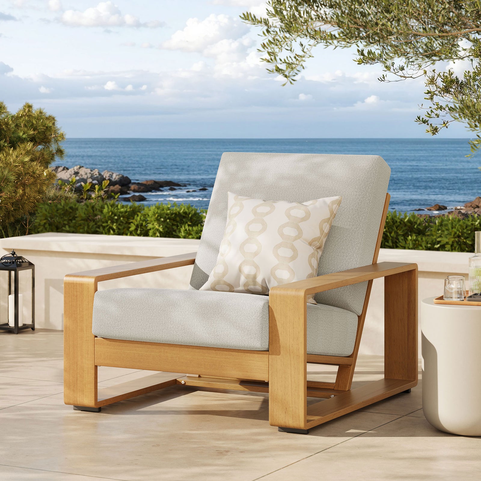 Ivory and natural faux wood armchair creating a serene focal point on a sunlit coastal patio || EEI-7296-IVO-NAT || front_angle_room